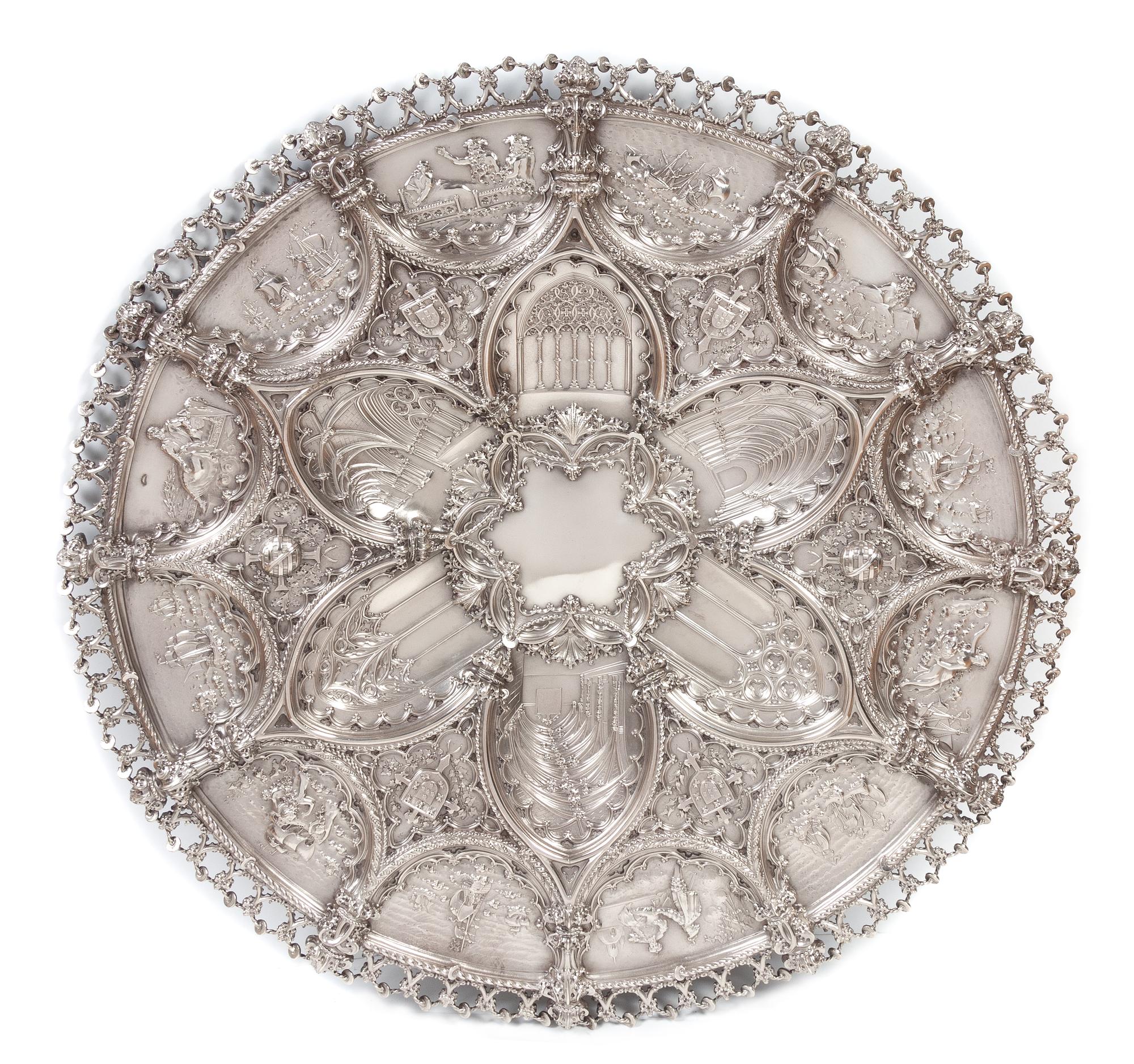 A Large Portuguese Silver Charger, Ourivesaria da Guia, Lisbon, Late 19th/Early 20th Century, having allover repousse decoration worked