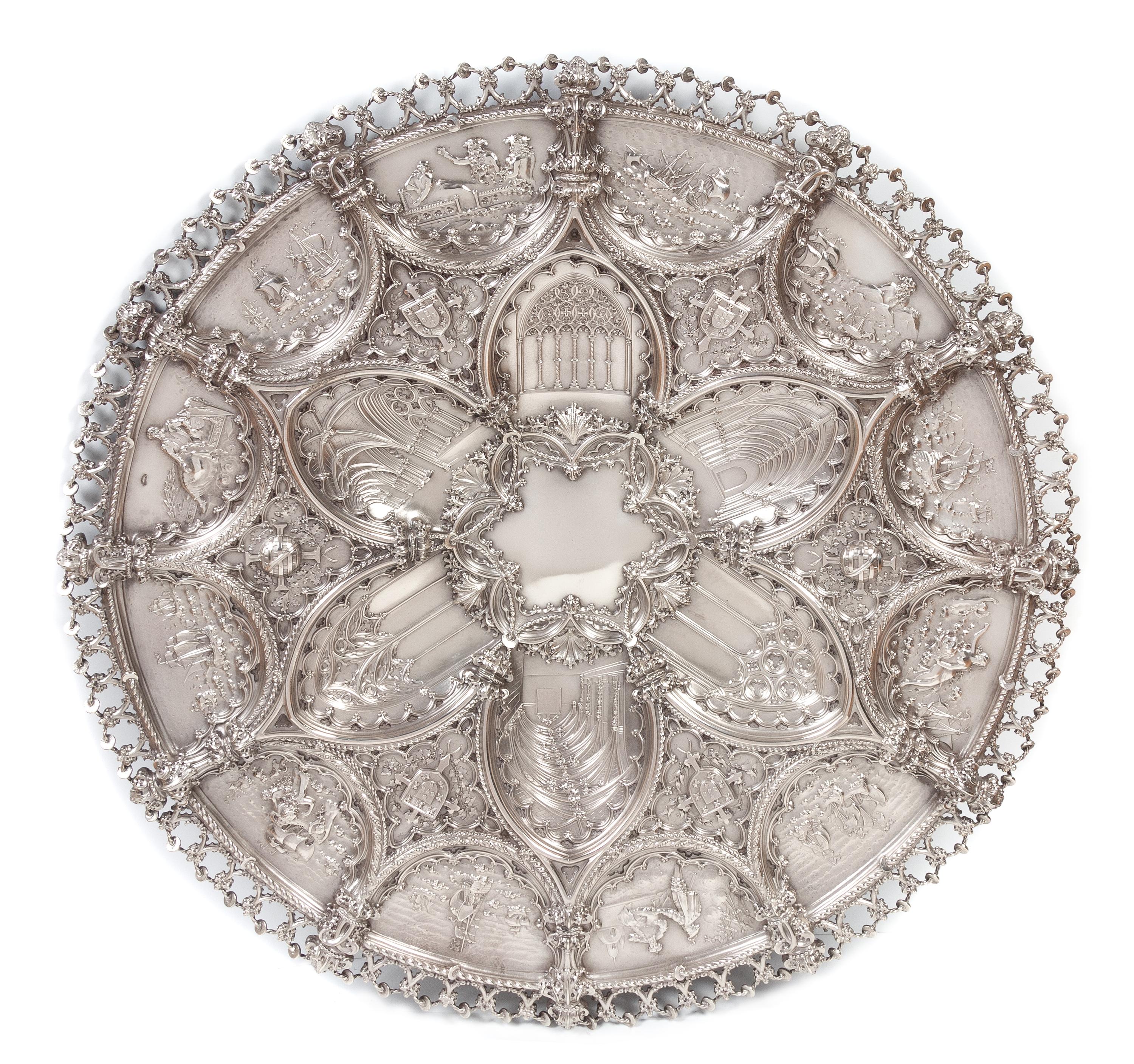 A Large Portuguese Silver Charger, Ourivesaria da Guia, Lisbon, Late 19th/Early 20th Century, having allover repousse decoration worked