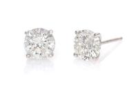 A Pair of 14 Karat White Gold and Diamond Stud Earrings, 0.90 dwts.