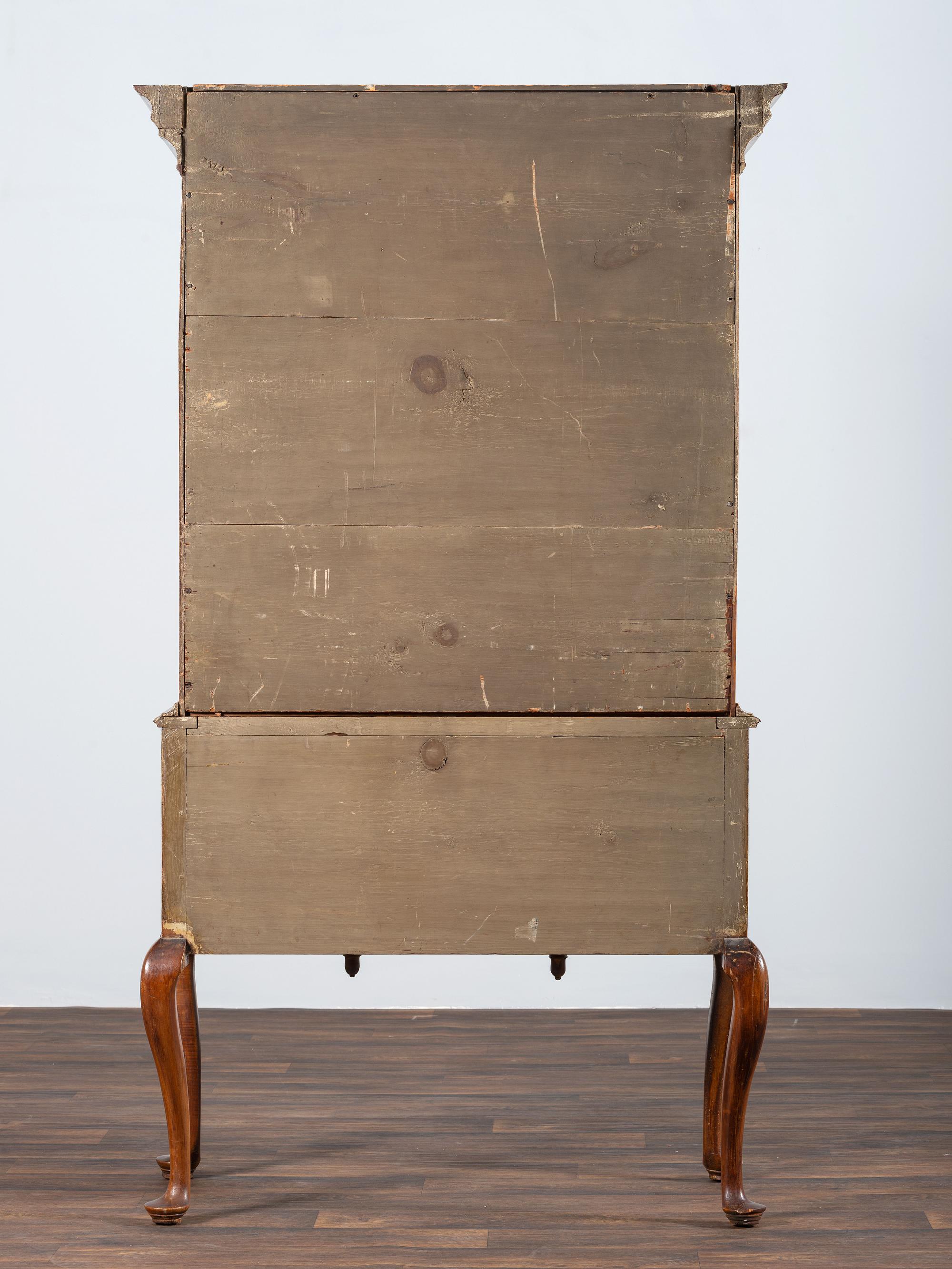 A Queen Anne Shell-Carved and Figured Maple Flat-Top High Chest of Drawers