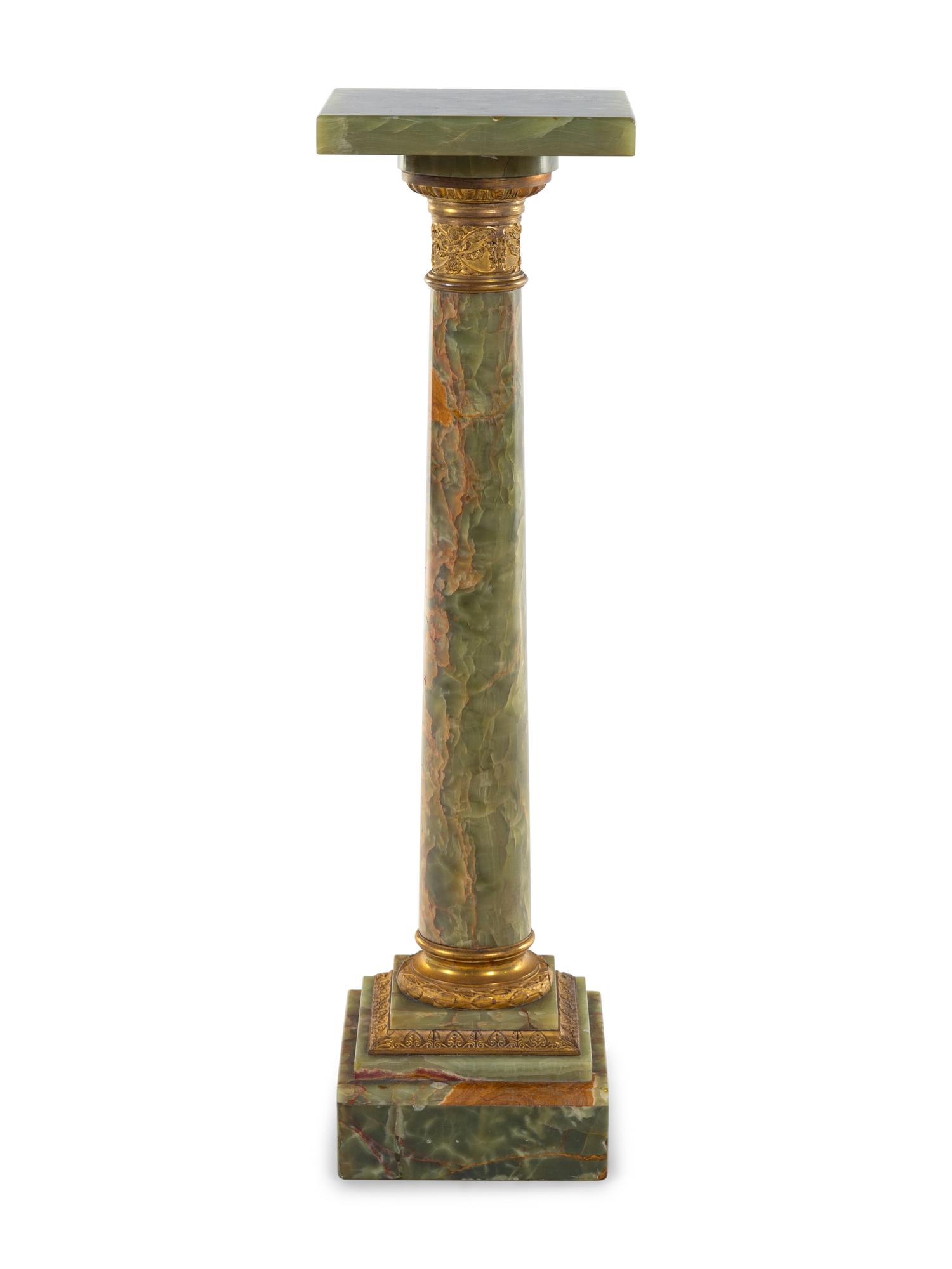 A Neoclassical Gilt Metal Mounted Onyx Pedestal