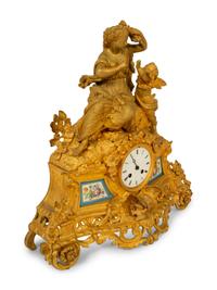 A Louis XV Style Gilt Bronze and Porcelain Inset Mantel Clock — 19TH CENTURY