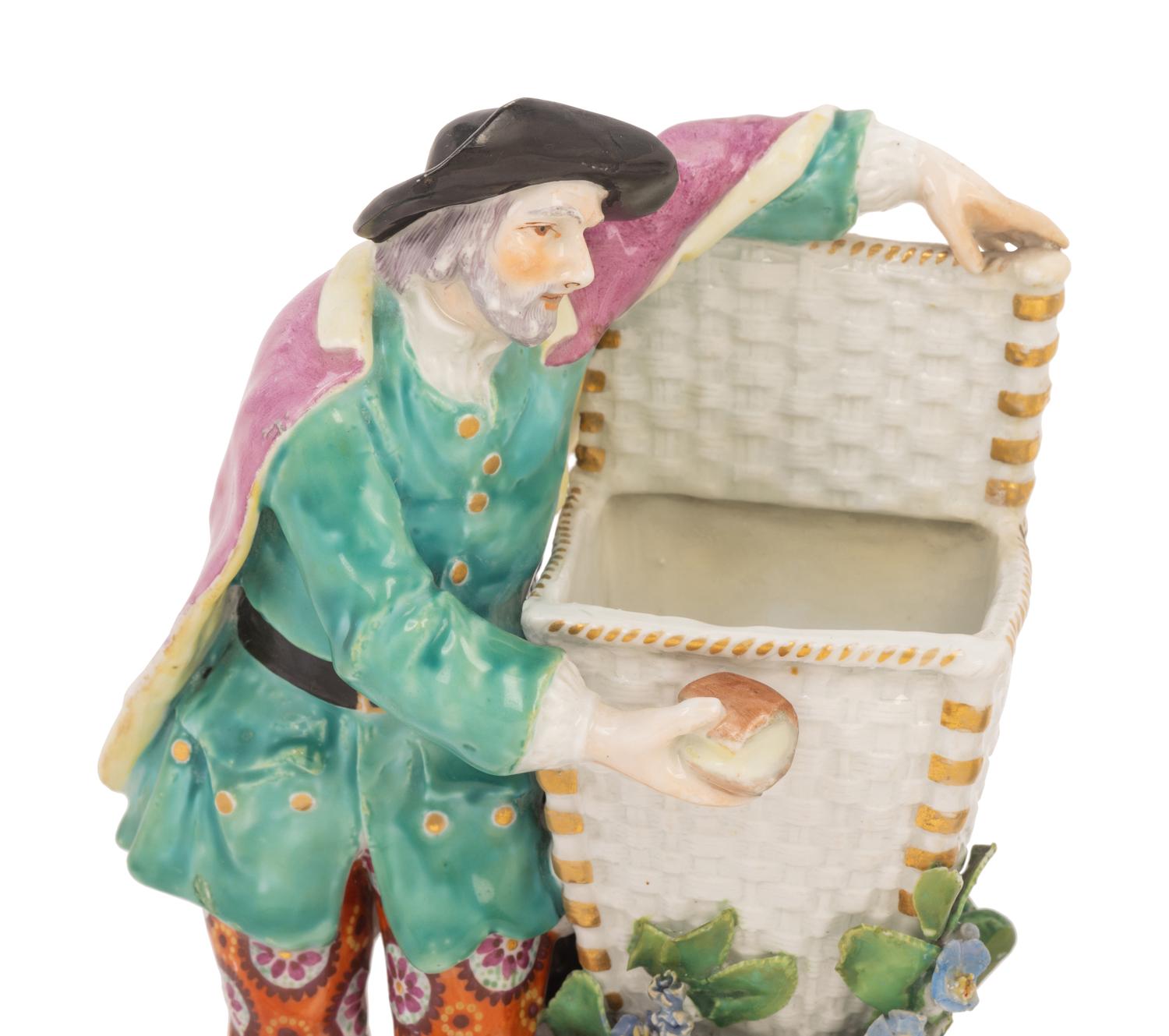 A Pair of Chelsea Porcelain Figures