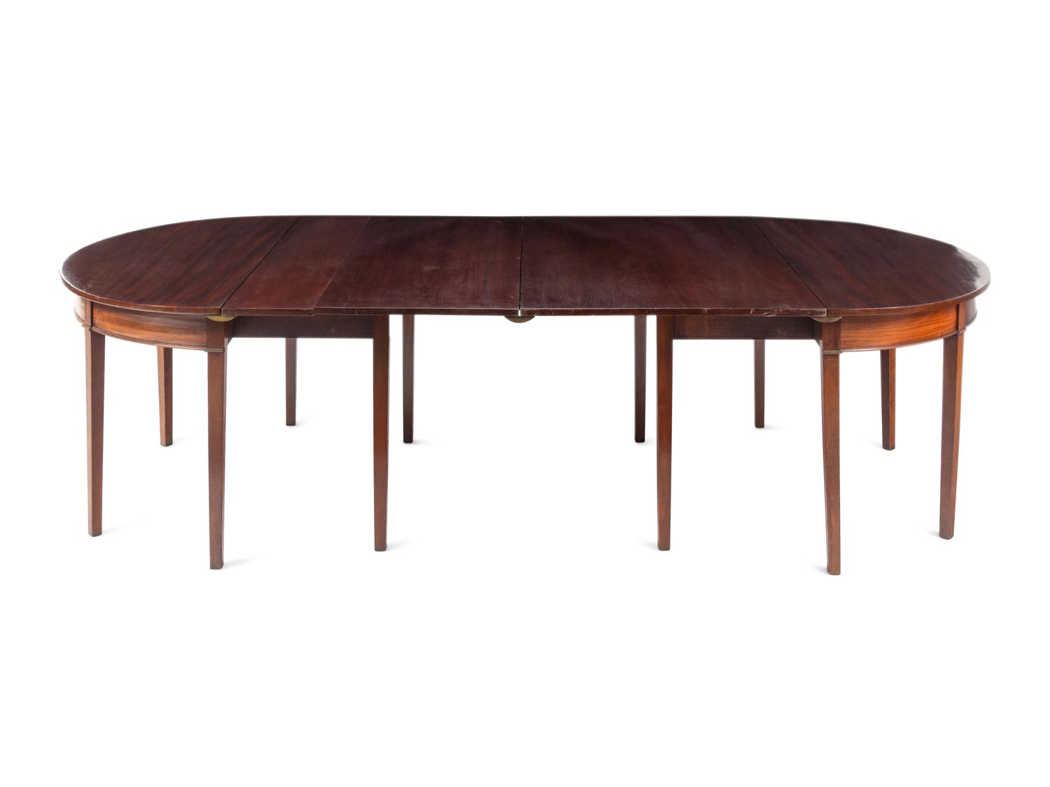 A Pair of George III Mahogany Demilune Console Tables Converting to a Dining Table