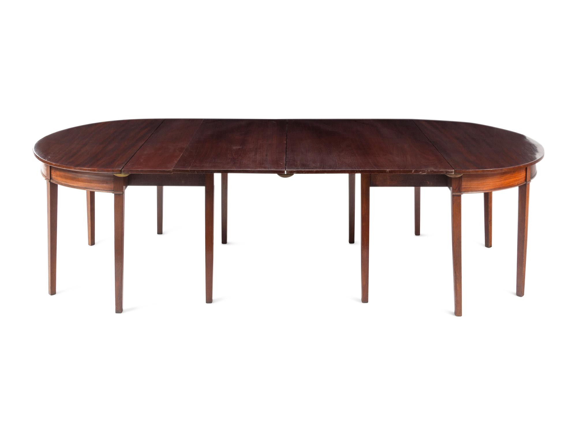 A Pair of George III Mahogany Demilune Console Tables Converting to a Dining Table