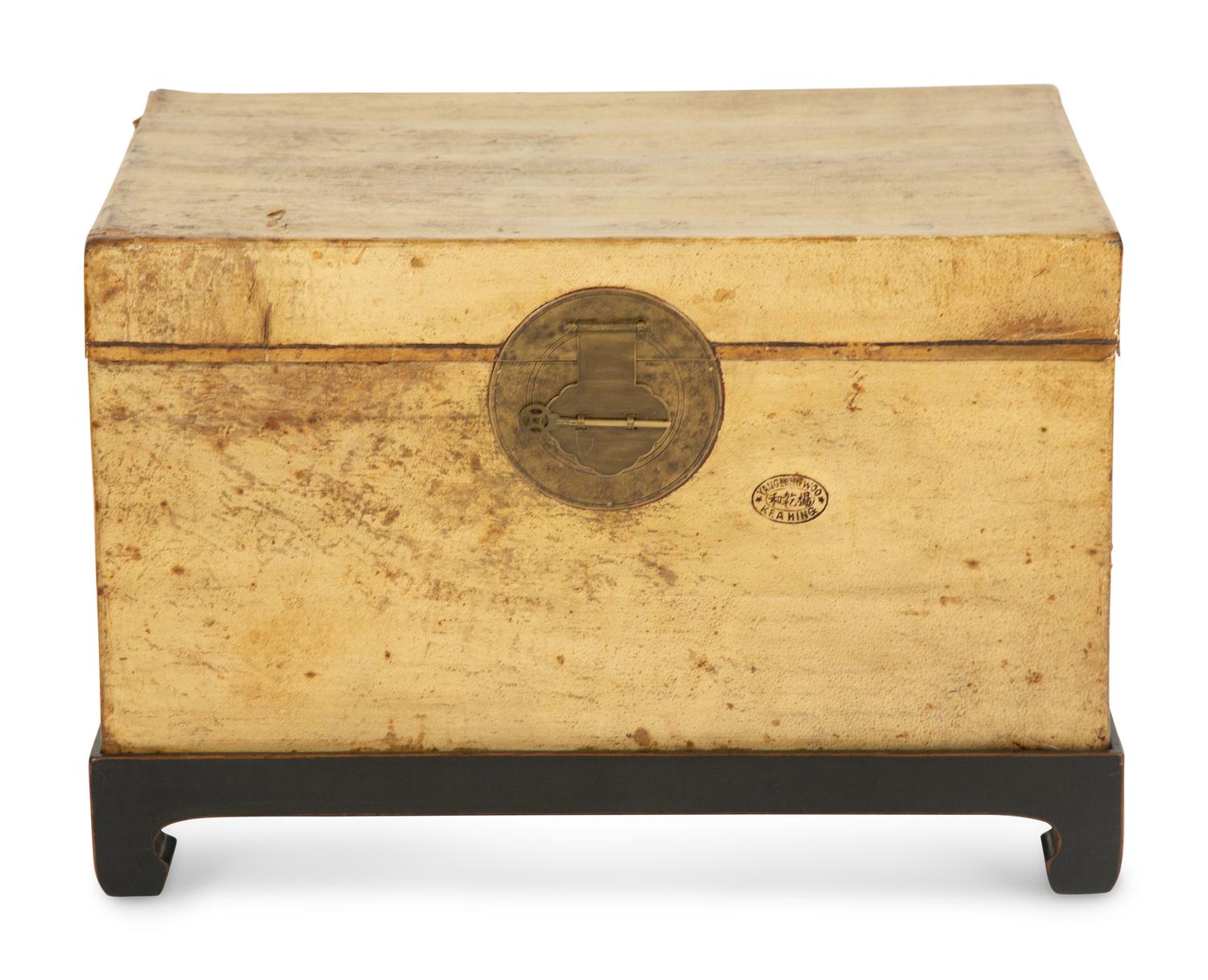 A Chinese Parchment Leather Bound Trunk with Brass Mounts and Handles