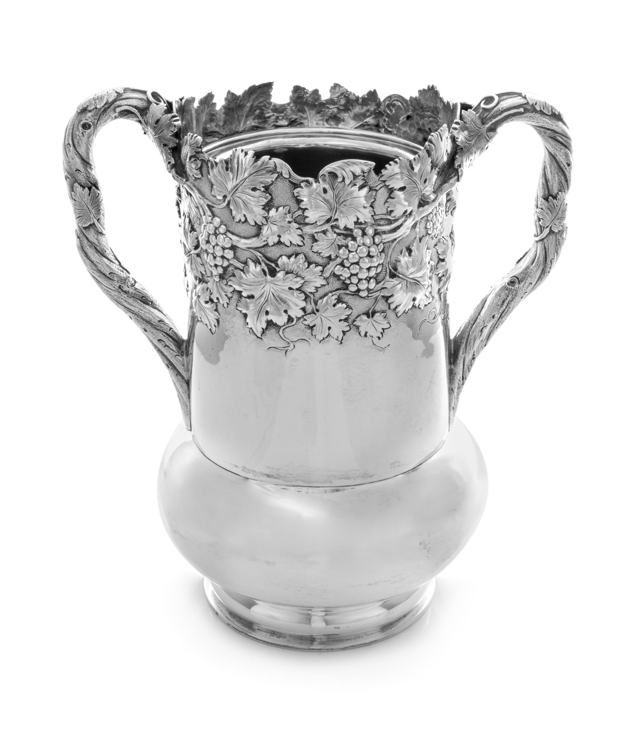 An American Coin Silver Wine Cooler, S. Kirk & Son, Baltimore, MD, the body worked to show grape clusters on a vine, each handle in the