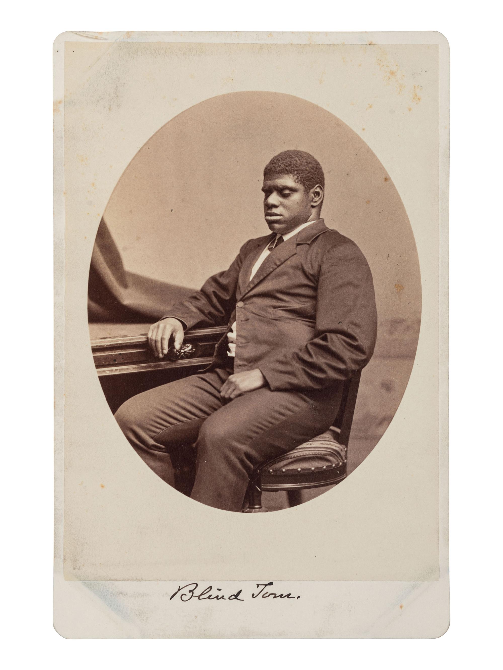 [MUSIC - WIGGINS, Thomas Greene "Blind Tom" (1849-1908)]. WARREN, George Kendall (1824-1884), photographer. Cabinet card of Blind Tom.