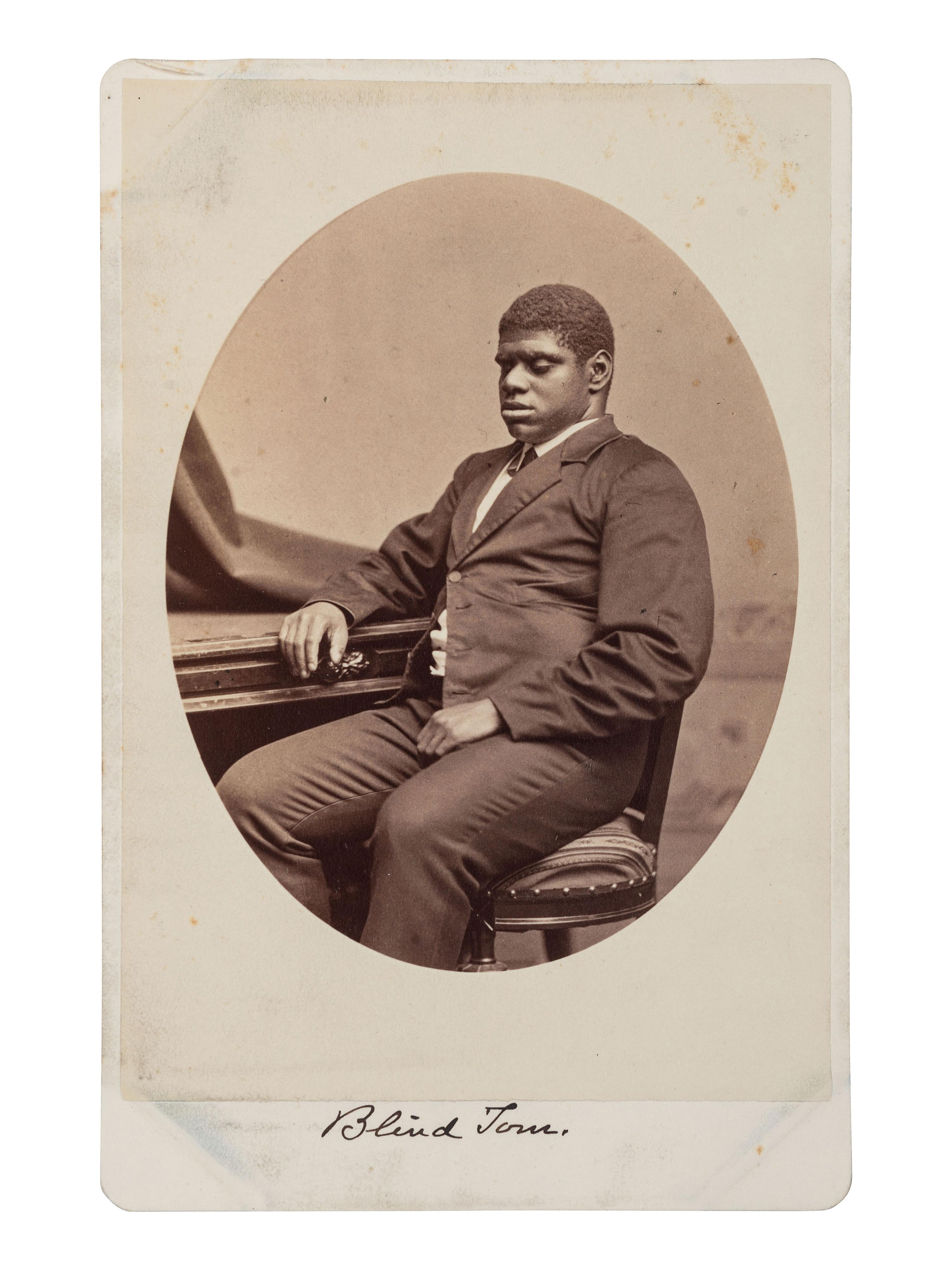 [MUSIC - WIGGINS, Thomas Greene "Blind Tom" (1849-1908)]. WARREN, George Kendall (1824-1884), photographer. Cabinet card of Blind Tom.