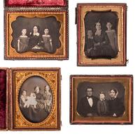 [EARLY PHOTOGRAPHY]. 11 quarter plate daguerreotypes of family pairs and groups.