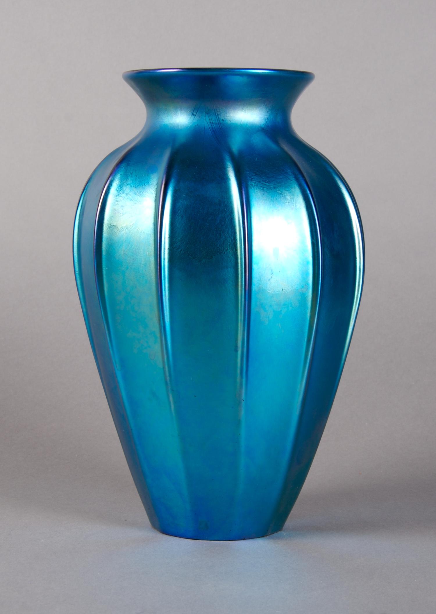 An Iridescent Glass Vase, in the Manner of Steuben, Height 8 inches.