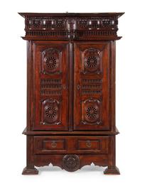 A Brittany Style Carved Walnut Armoire