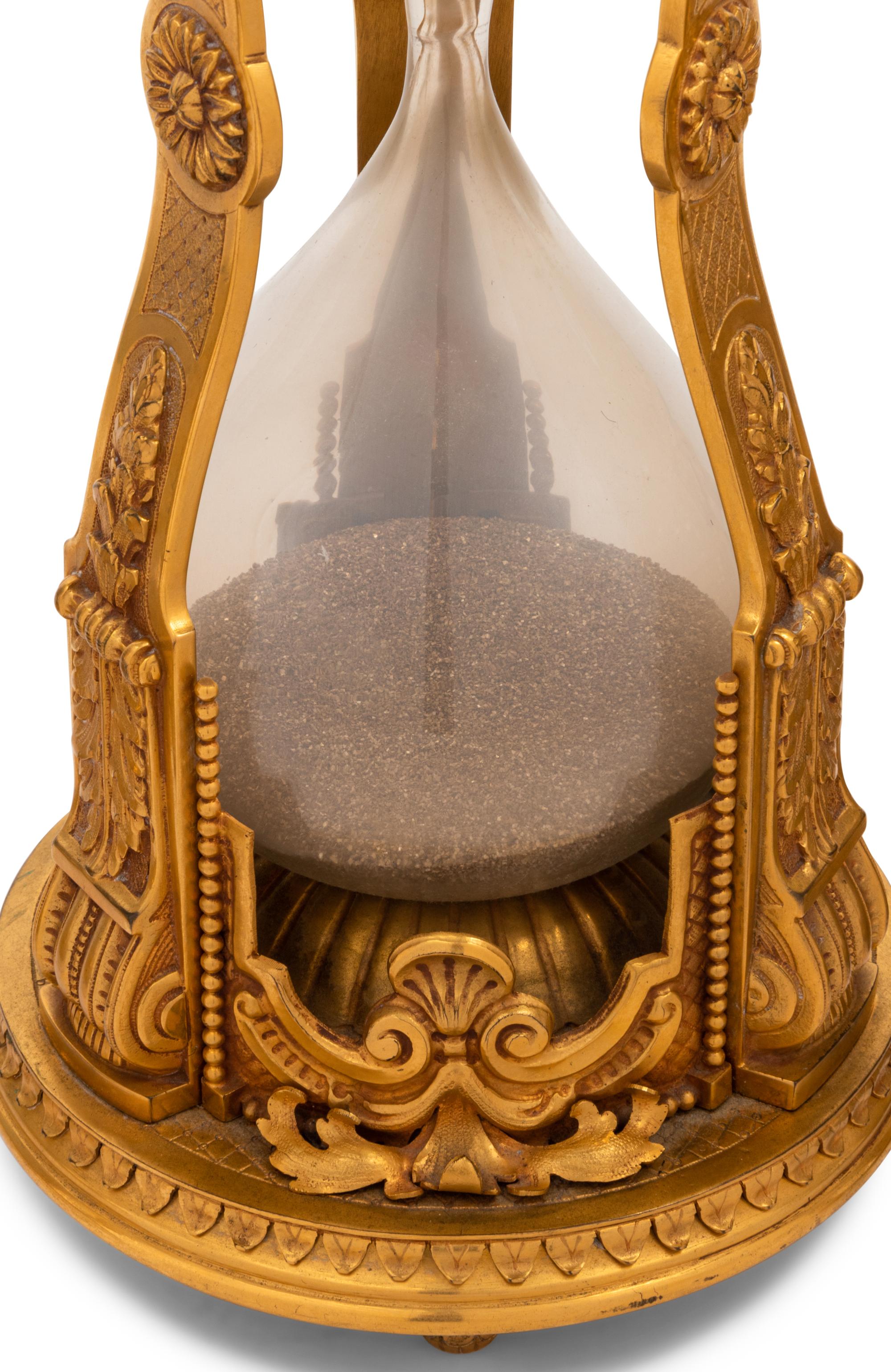 A French Gilt Bronze Mounted Hourglass and Two Associated Figural Centerpiece Bowls