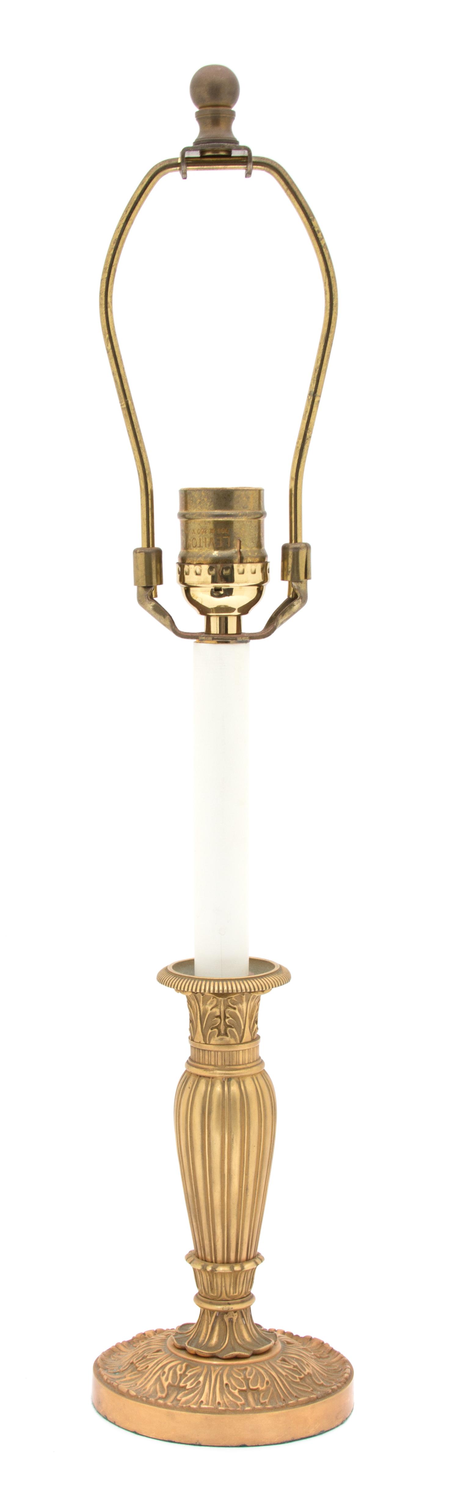 A French Empire Style Gilt Bronze Candlestick-Form Lamp Height overall 20 1/2 inches. — 20TH CENTURY