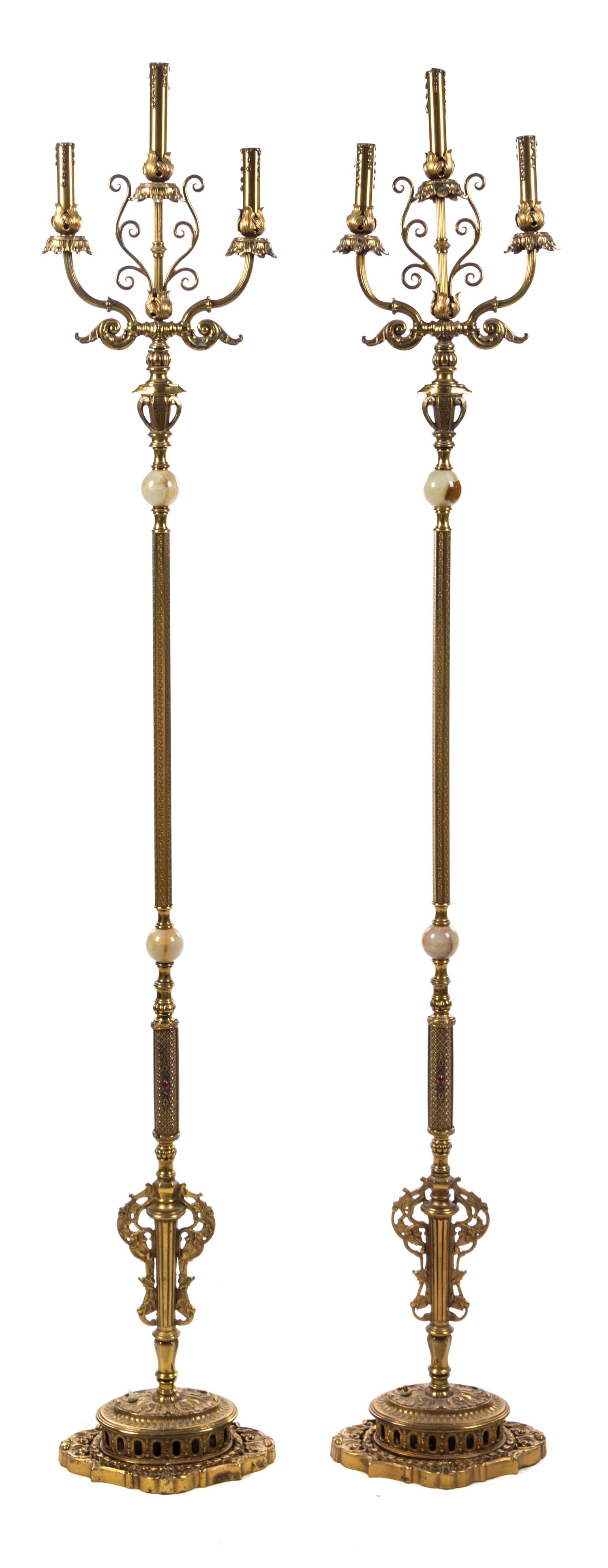 A Pair of Gilt Bronze and Onyx Three-Light Floor Lamps Height 68 1/2 inches.