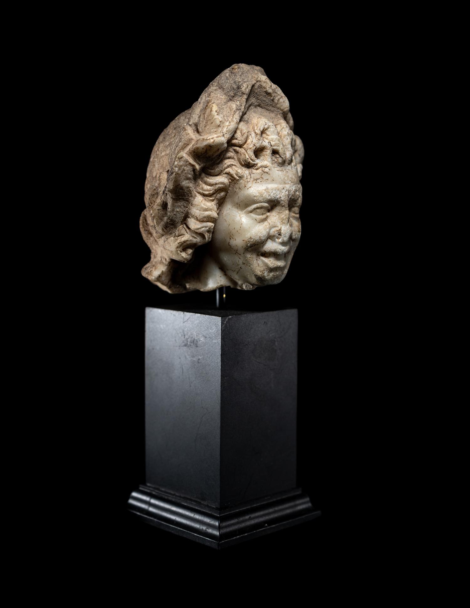 A Roman Marble Head of a Satyr