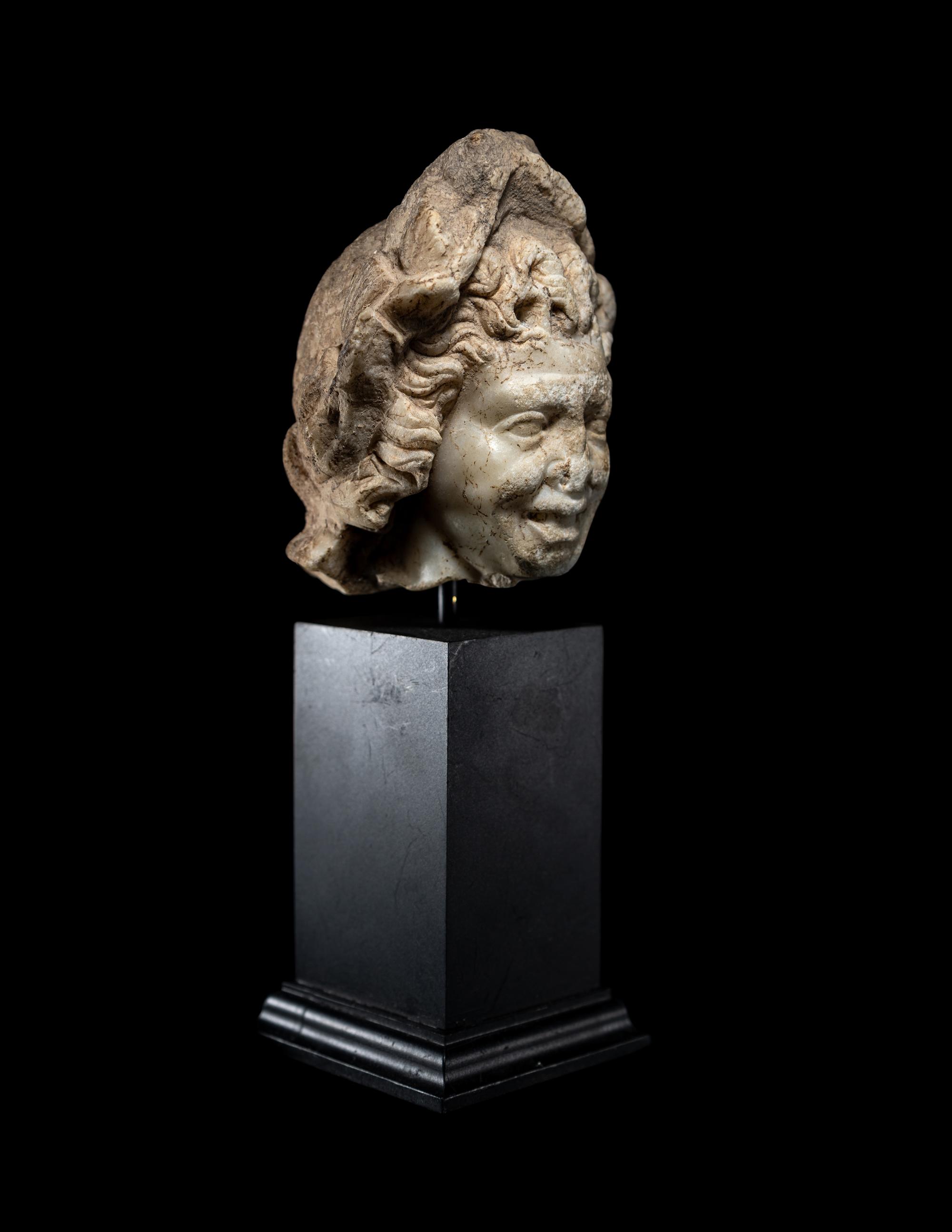 A Roman Marble Head of a Satyr