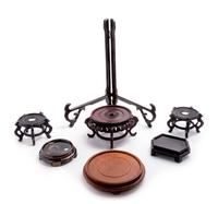 A Collection of Chinese Hardwood Stands Height of tallest overall 20 inches.