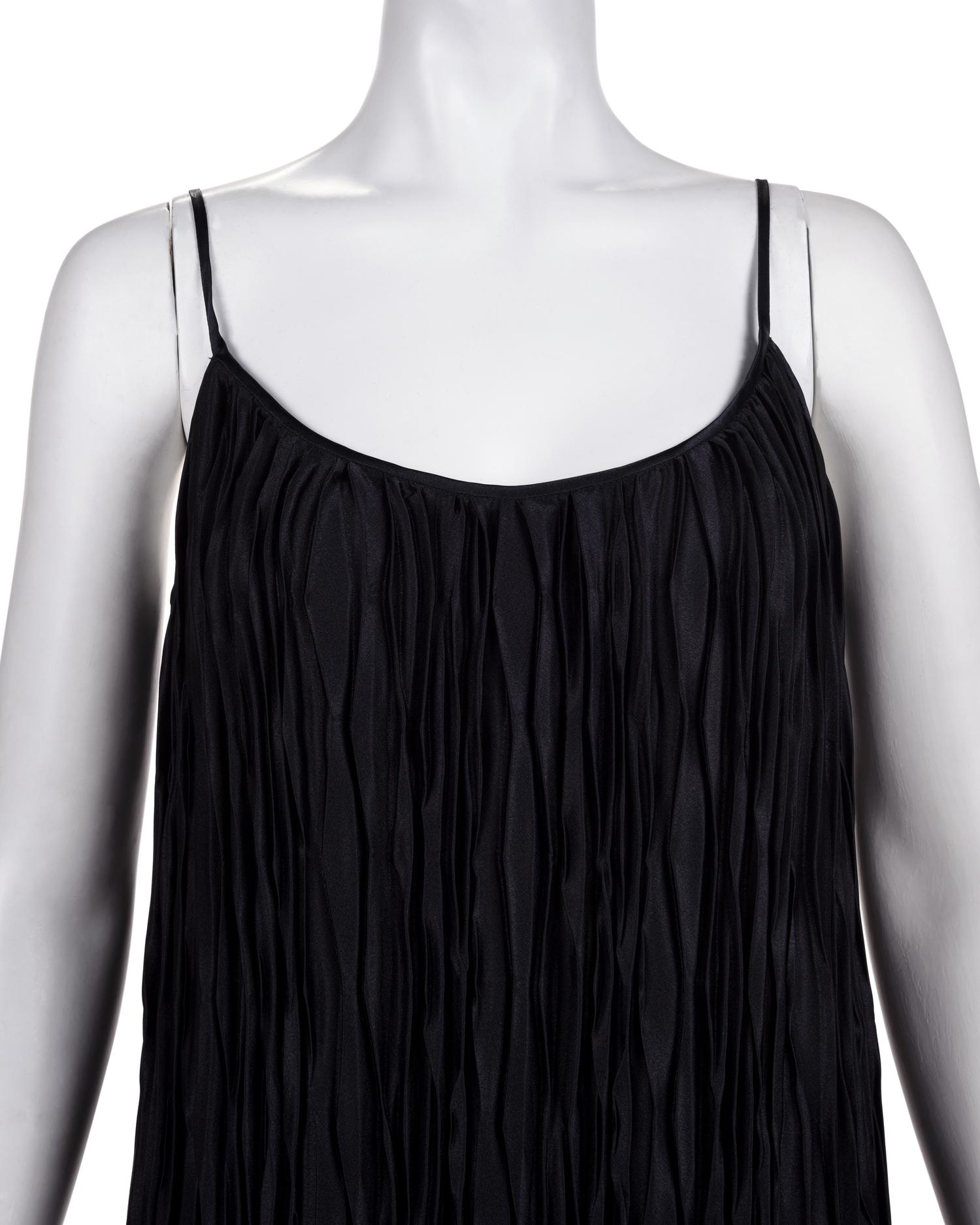 Three Pleated Items: One Zandra Rhodes Bolero and Dress, and One Mary McFadden Dress with Belt, 1980s