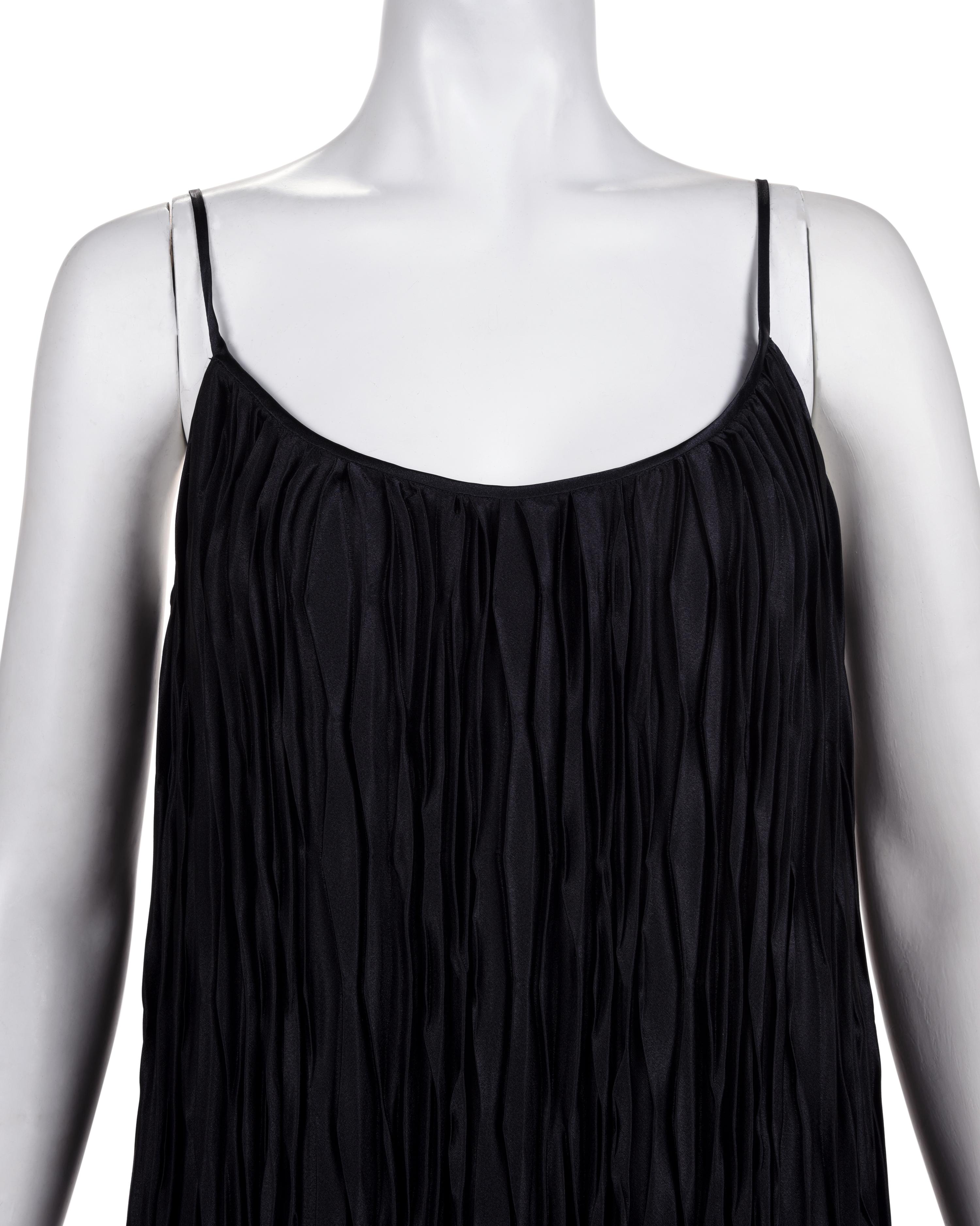Three Pleated Items: One Zandra Rhodes Bolero and Dress, and One Mary McFadden Dress with Belt, 1980s