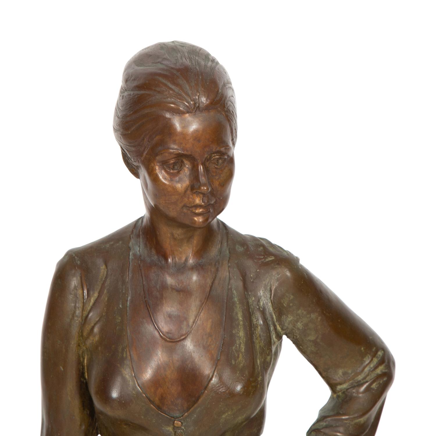 A Bronze Sculpture of a Standing Woman