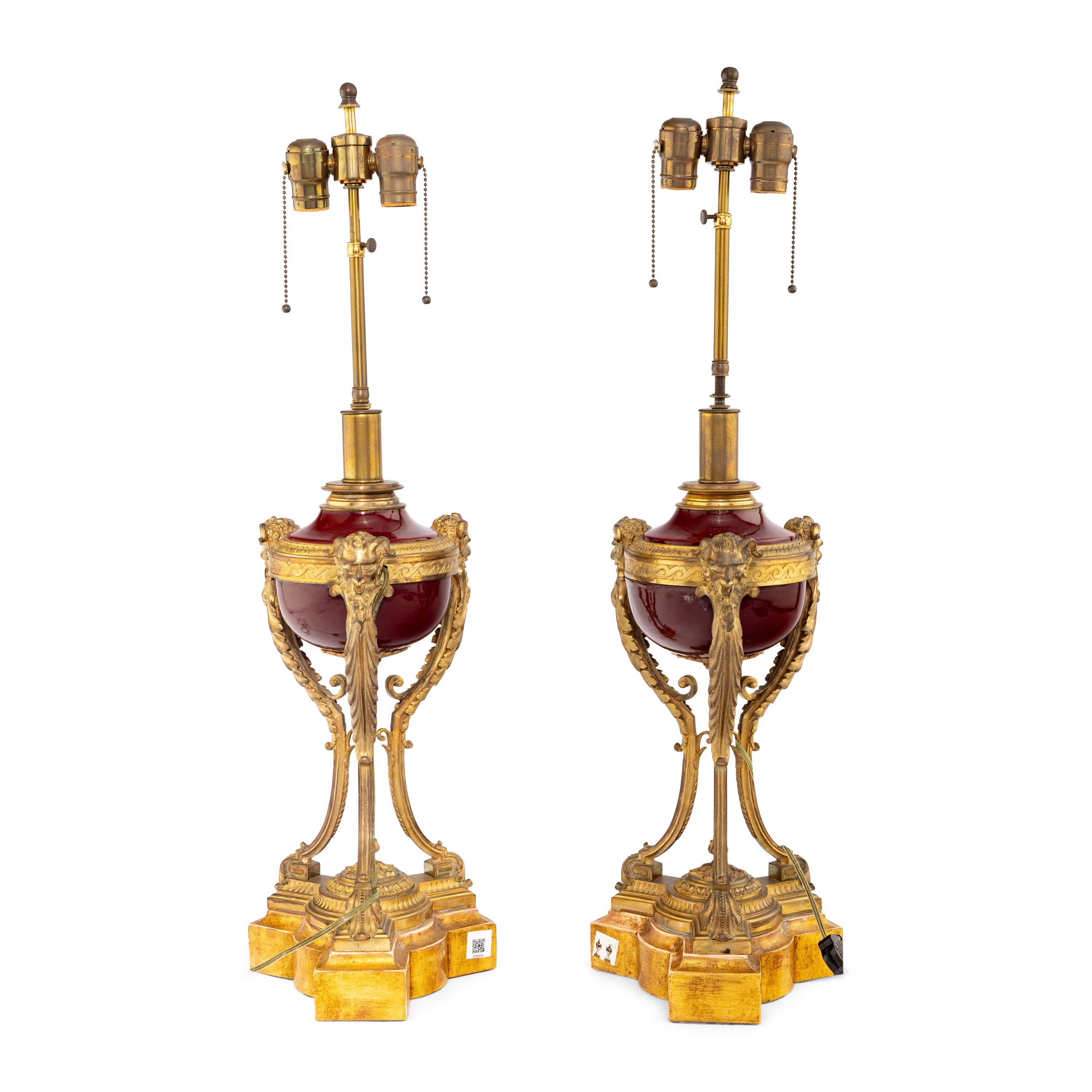 A Pair of Louis XVI Style Gilt Bronze Mounted Porcelain Urns