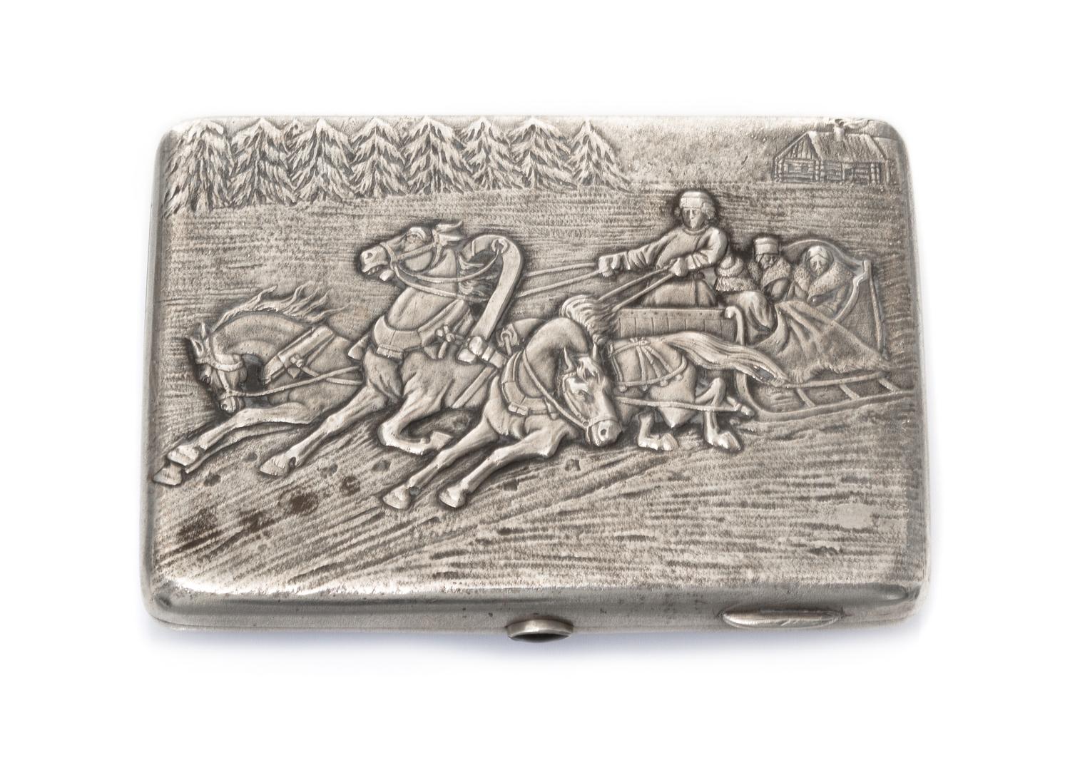 A Russian Silver Cigarette Case, Makers mark KK, Moscow, the lid worked to show a winter landscape centered by riders in a troika, havi