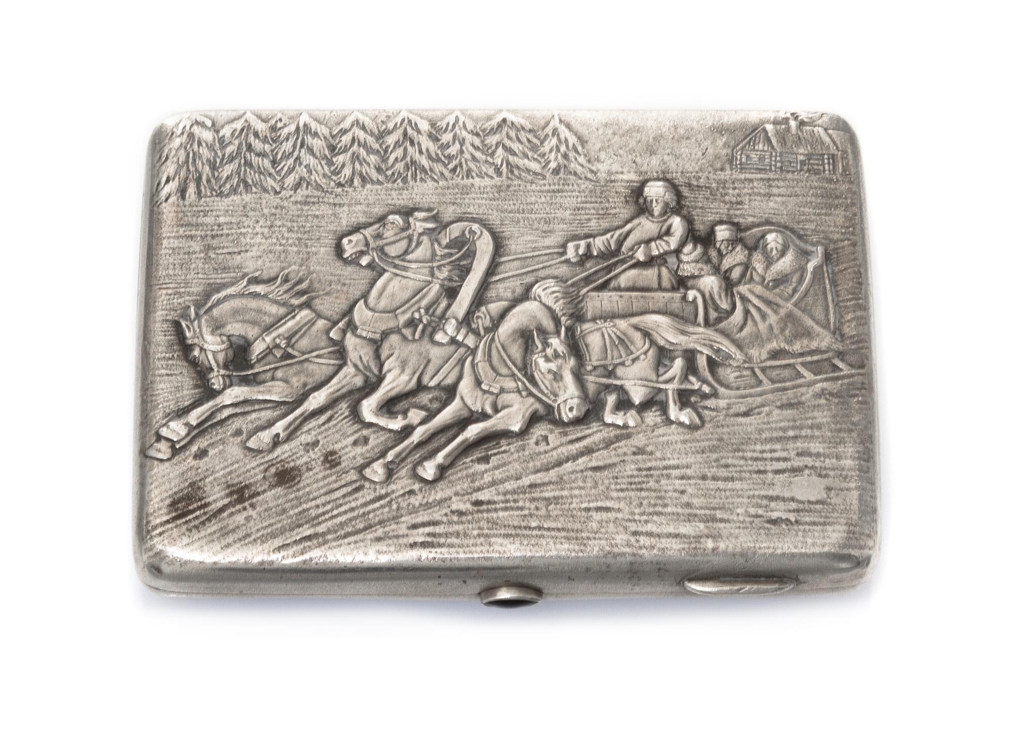 A Russian Silver Cigarette Case, Makers mark KK, Moscow, the lid worked to show a winter landscape centered by riders in a troika, havi