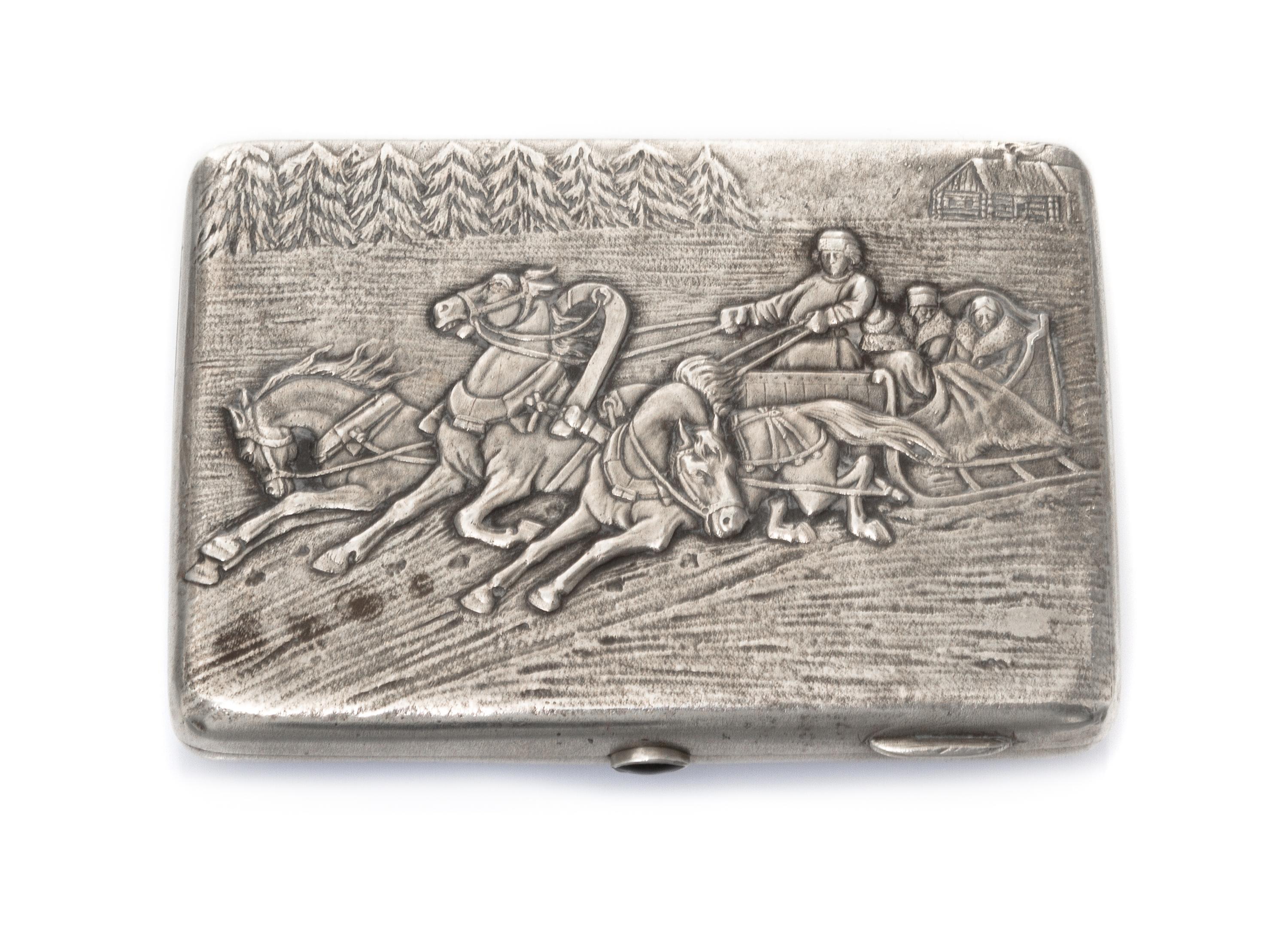 A Russian Silver Cigarette Case, Makers mark KK, Moscow, the lid worked to show a winter landscape centered by riders in a troika, havi