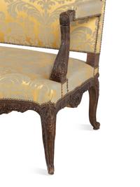 A Louis XV Style Carved Walnut and Silk Damask Upholstered Settee