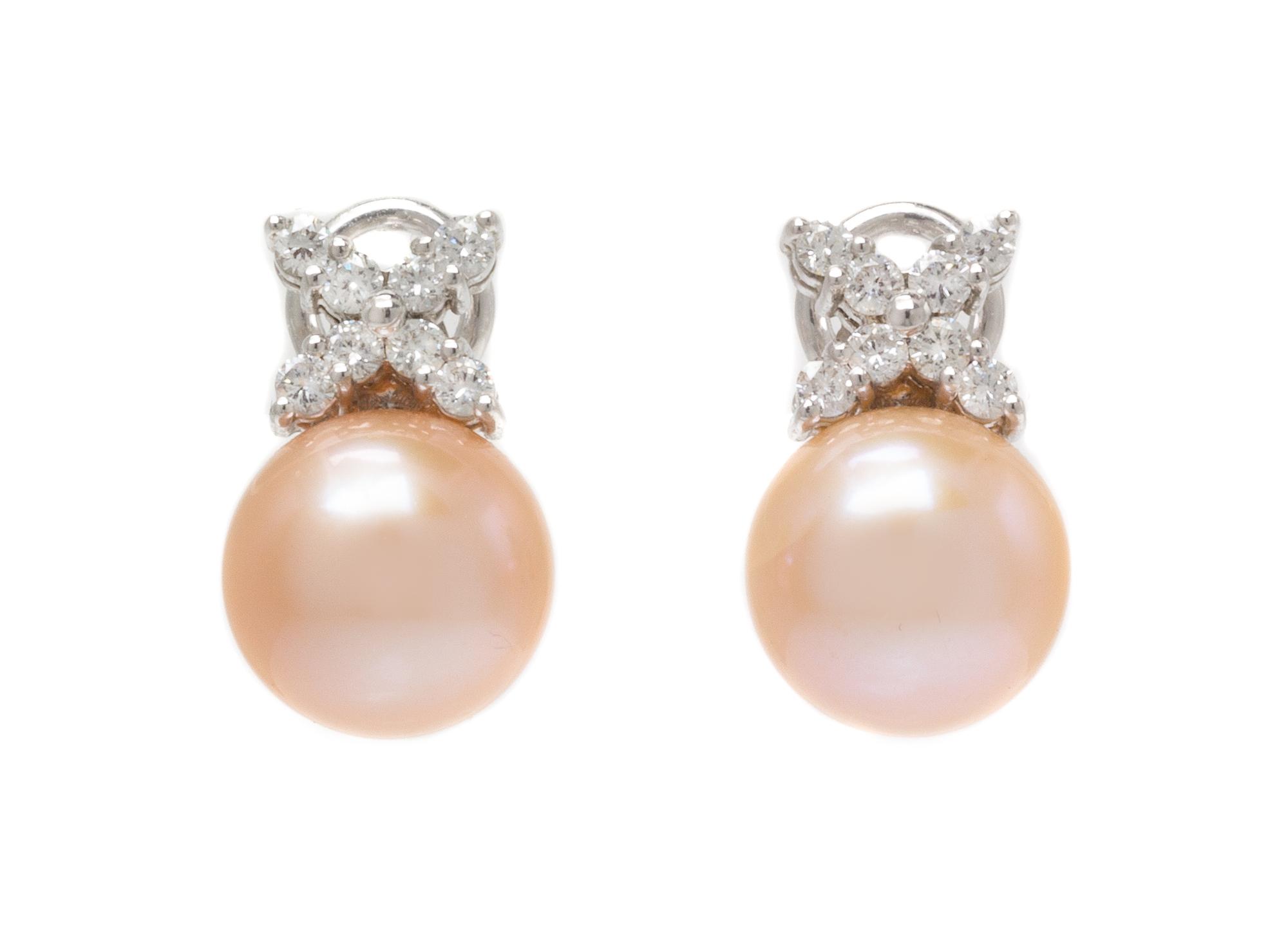 A Pair of 18 Karat White Gold, Cultured Pearl and Diamond Earclips, 5.45 dwts.