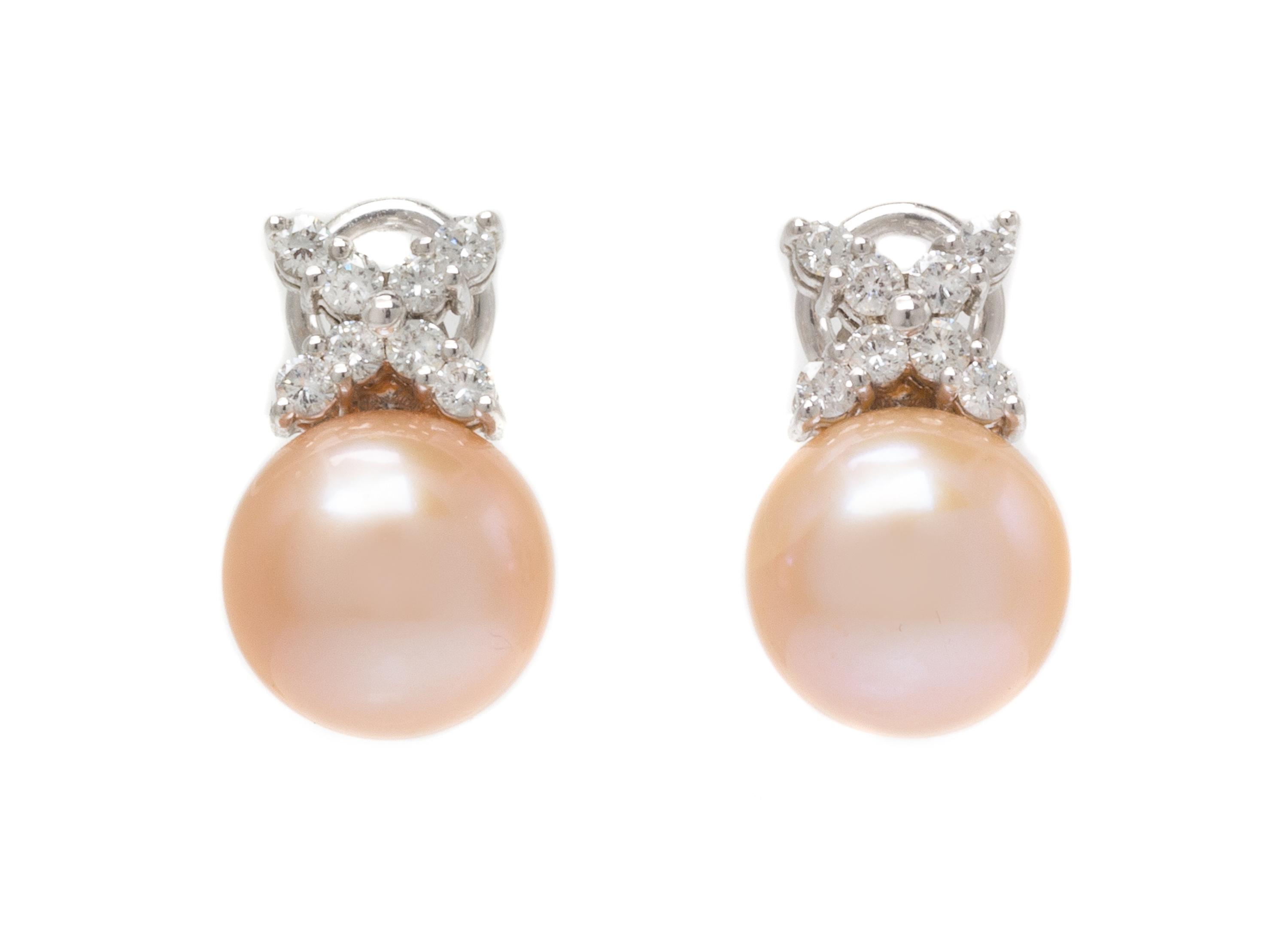 A Pair of 18 Karat White Gold, Cultured Pearl and Diamond Earclips, 5.45 dwts.