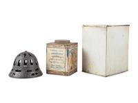 A Cast Iron String Holder and Two Advertising Tins