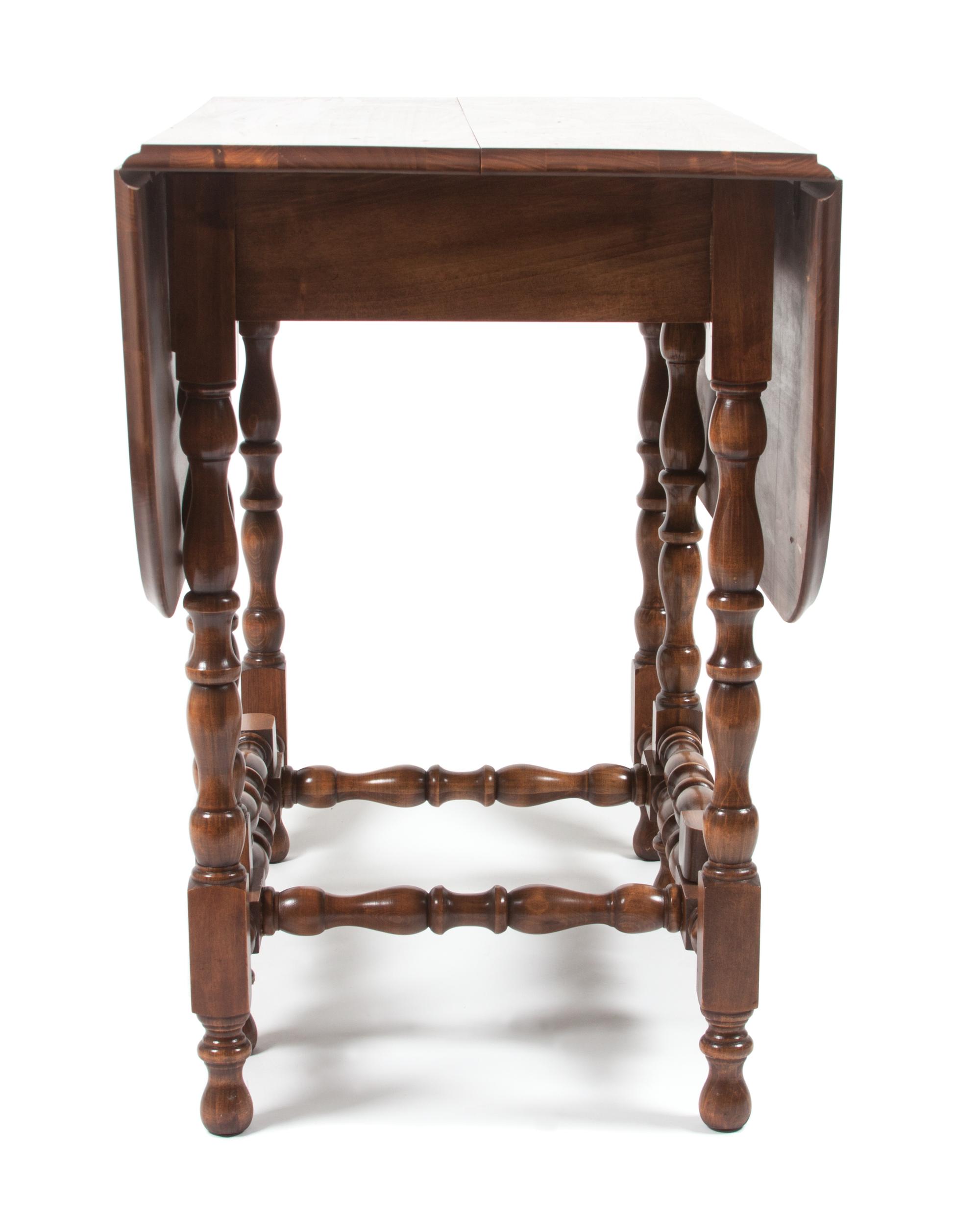 An American Mahogany Gate Leg Table Height 30 x width 46 1/2 x depth 35 inches (open). — 20TH CENTURY