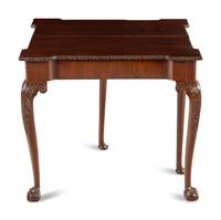 An Irish George III Carved Mahogany Flip-Top Table
