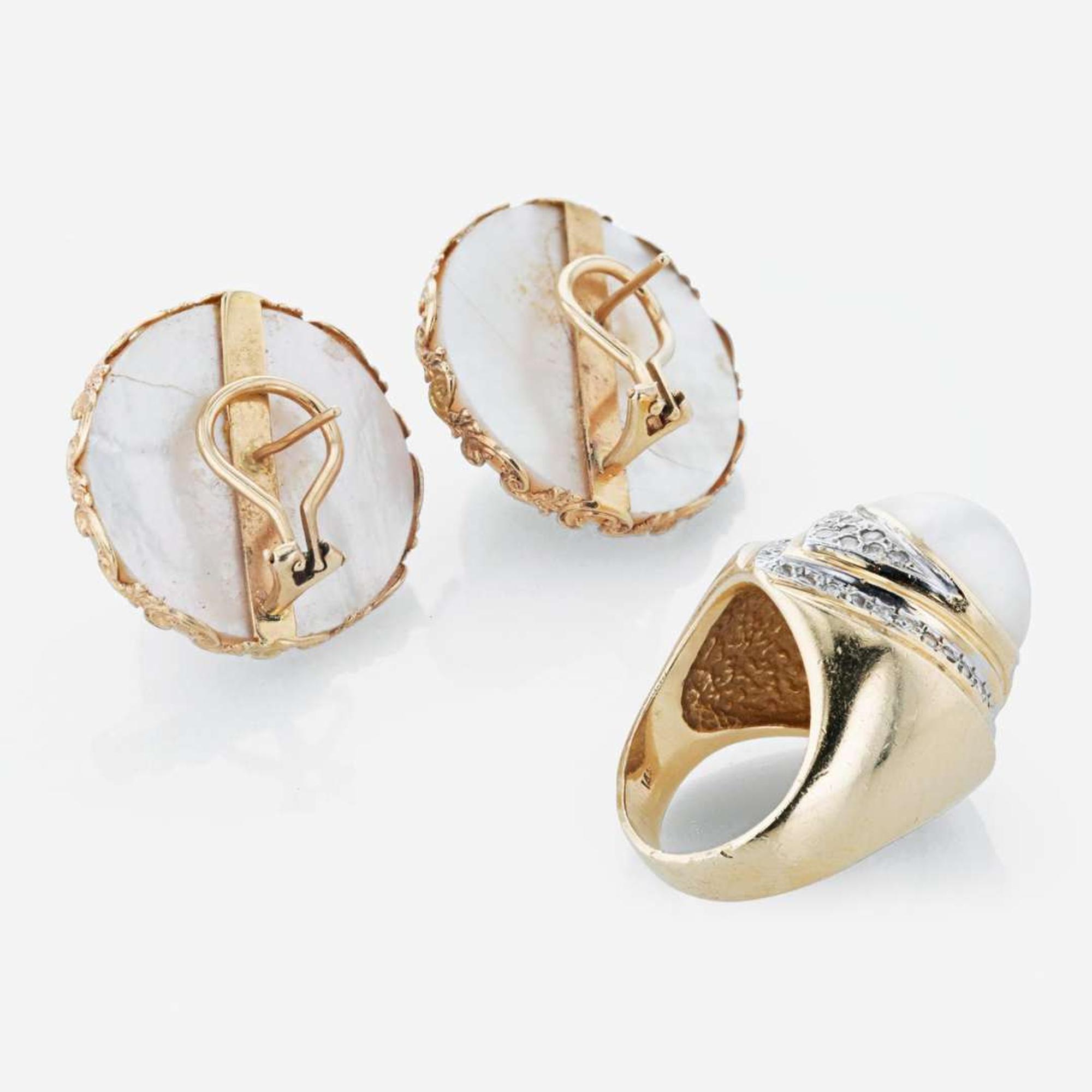 A 14K yellow gold pair of earrings and pearl and diamond ring
