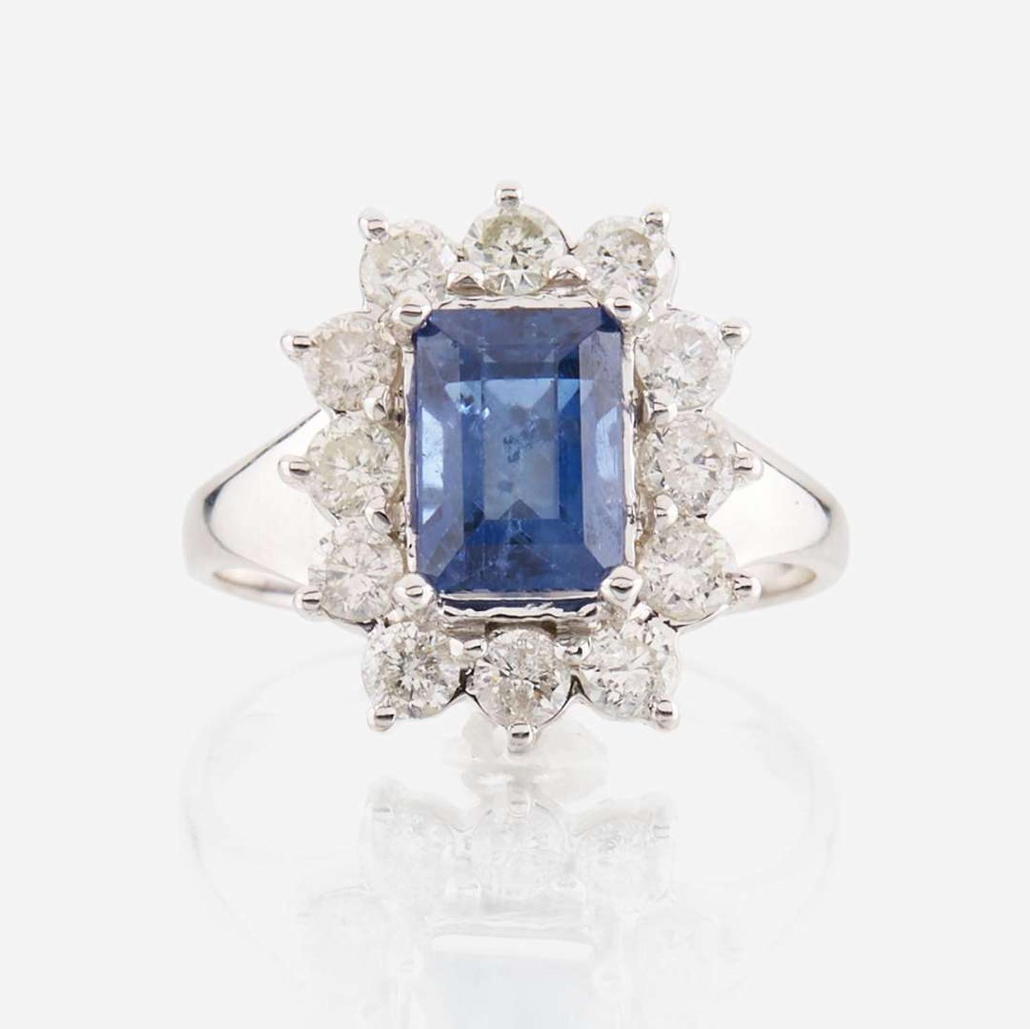 A sapphire, diamond, and white gold ring