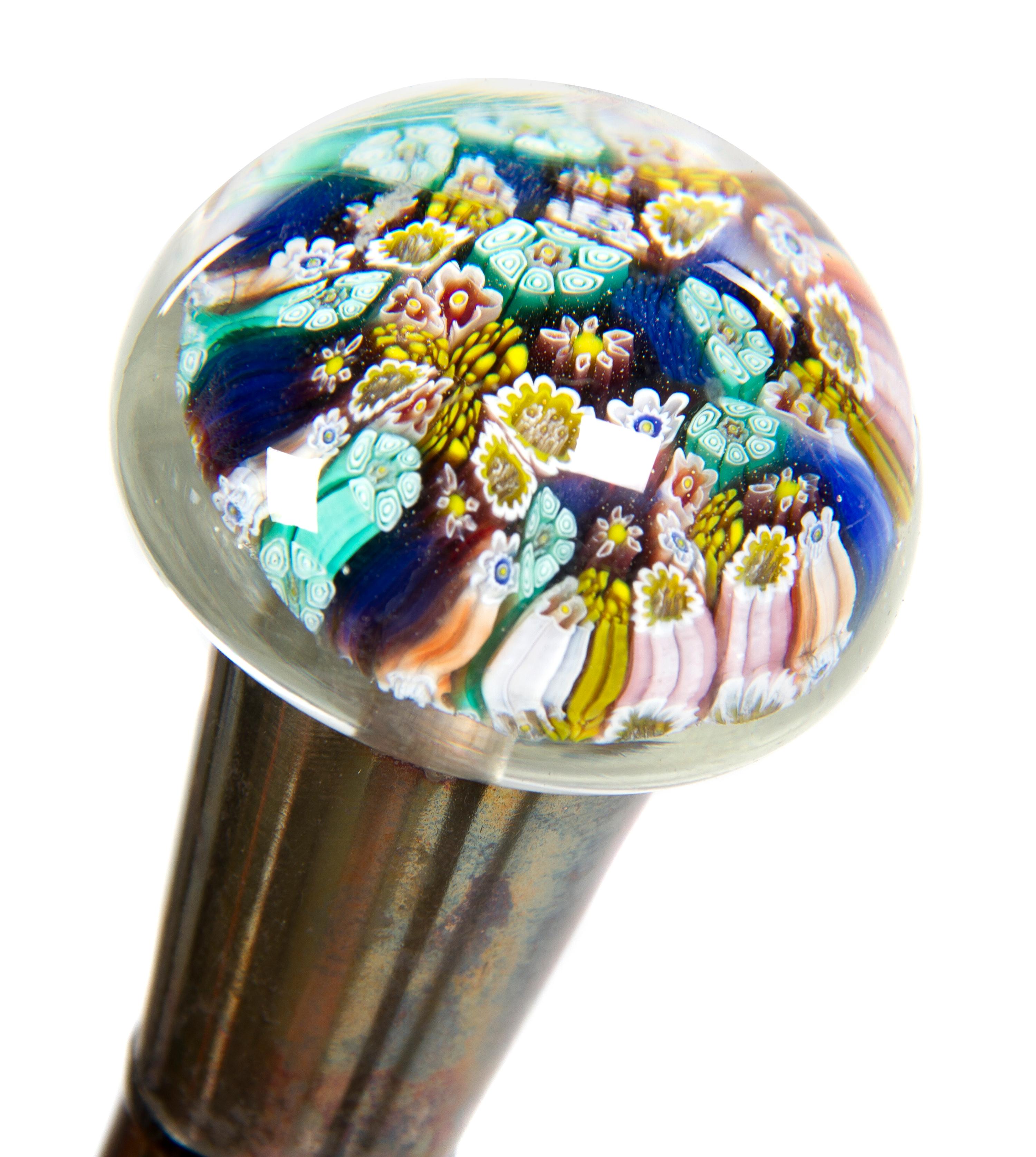 A Glass Paperweight Mounted Walking Stick, Height overall 35 1/2 x width of handle 1 3/4 inches.