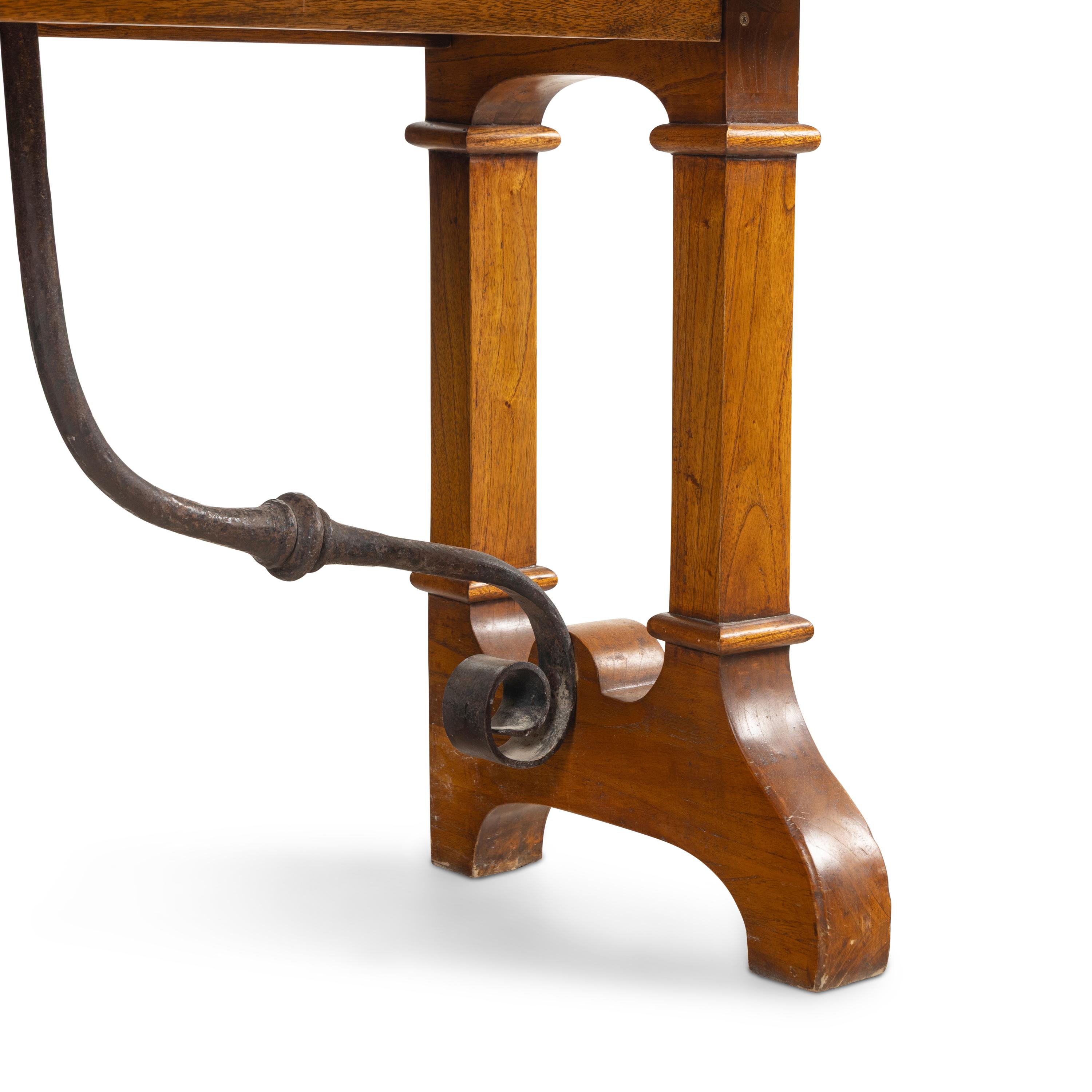 An Iron Mounted Oak Trestle Table