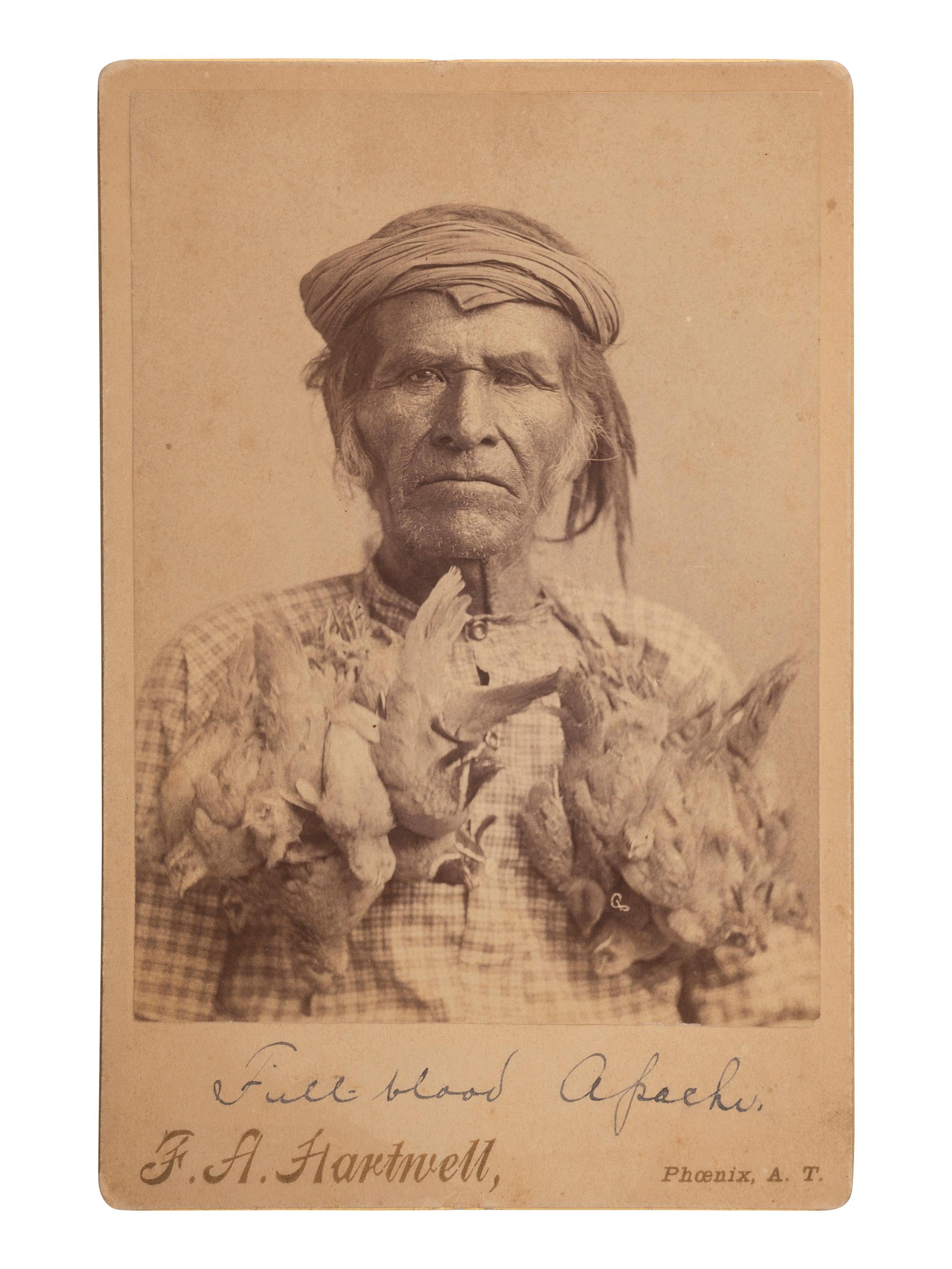 [NATIVE AMERICANS]. HARTWELL, F.A., photographer. Cabinet photograph of Apache subject with birds.