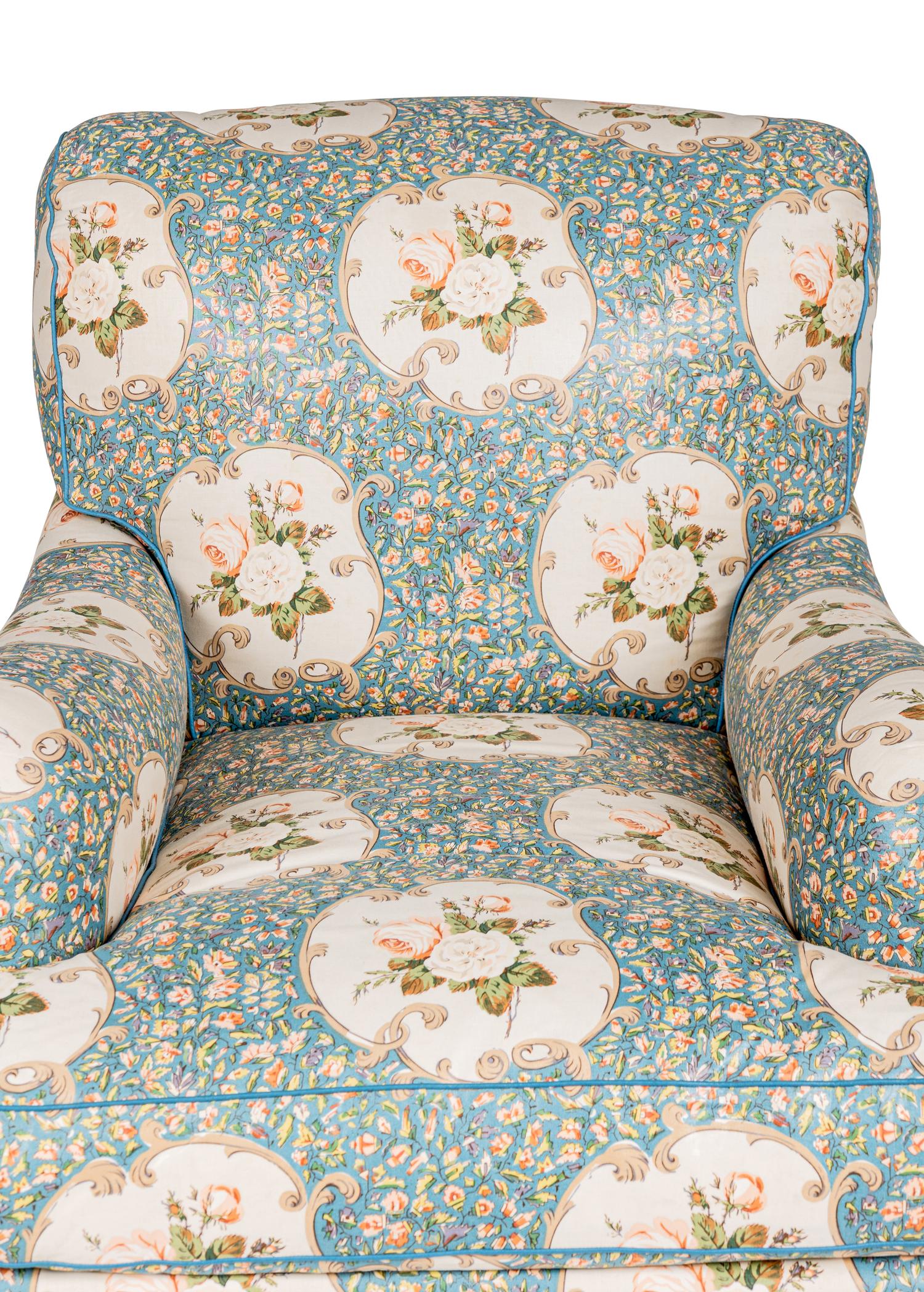 An English Chintz-Upholstered Easy Chair and Ottoman