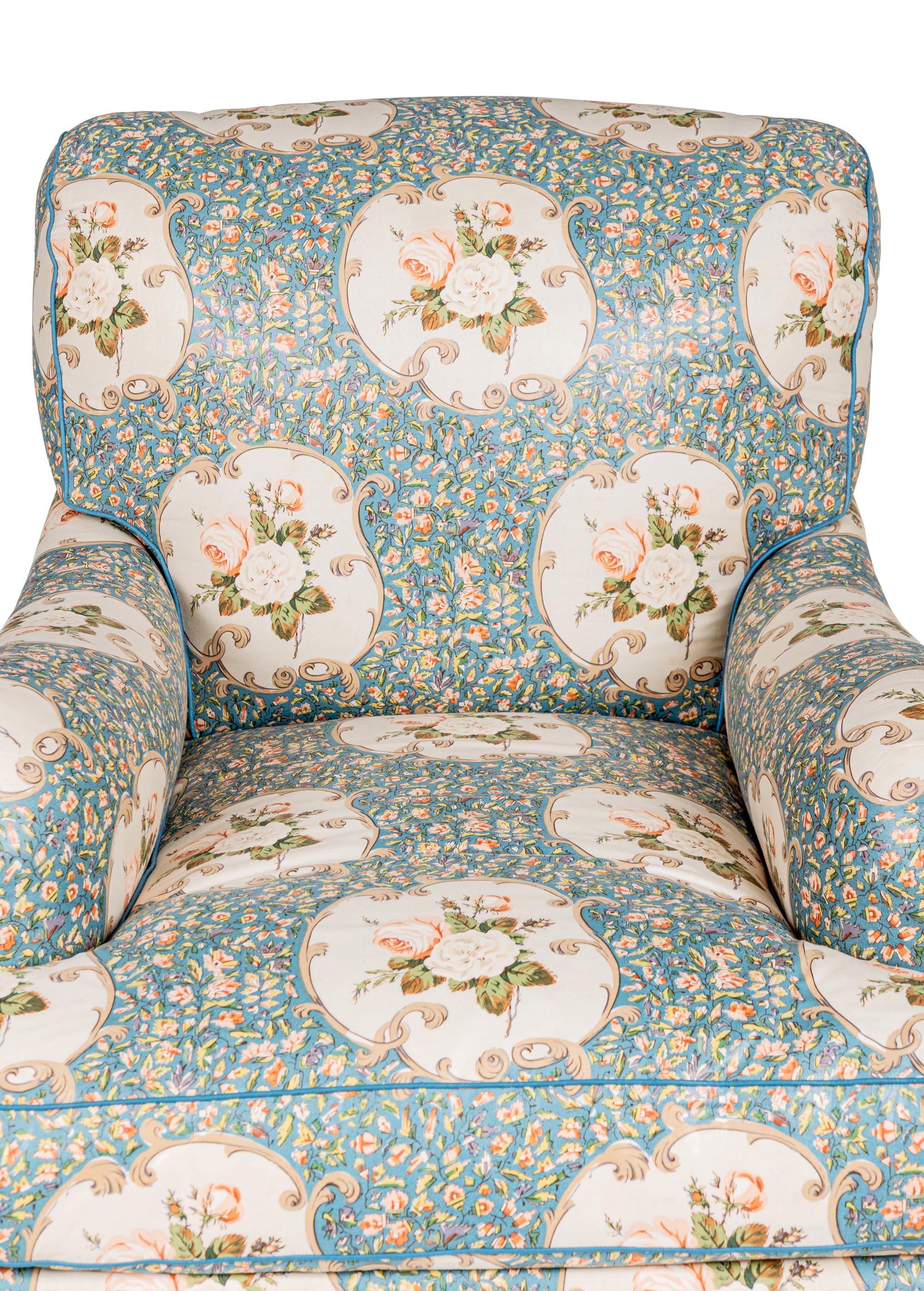 An English Chintz-Upholstered Easy Chair and Ottoman