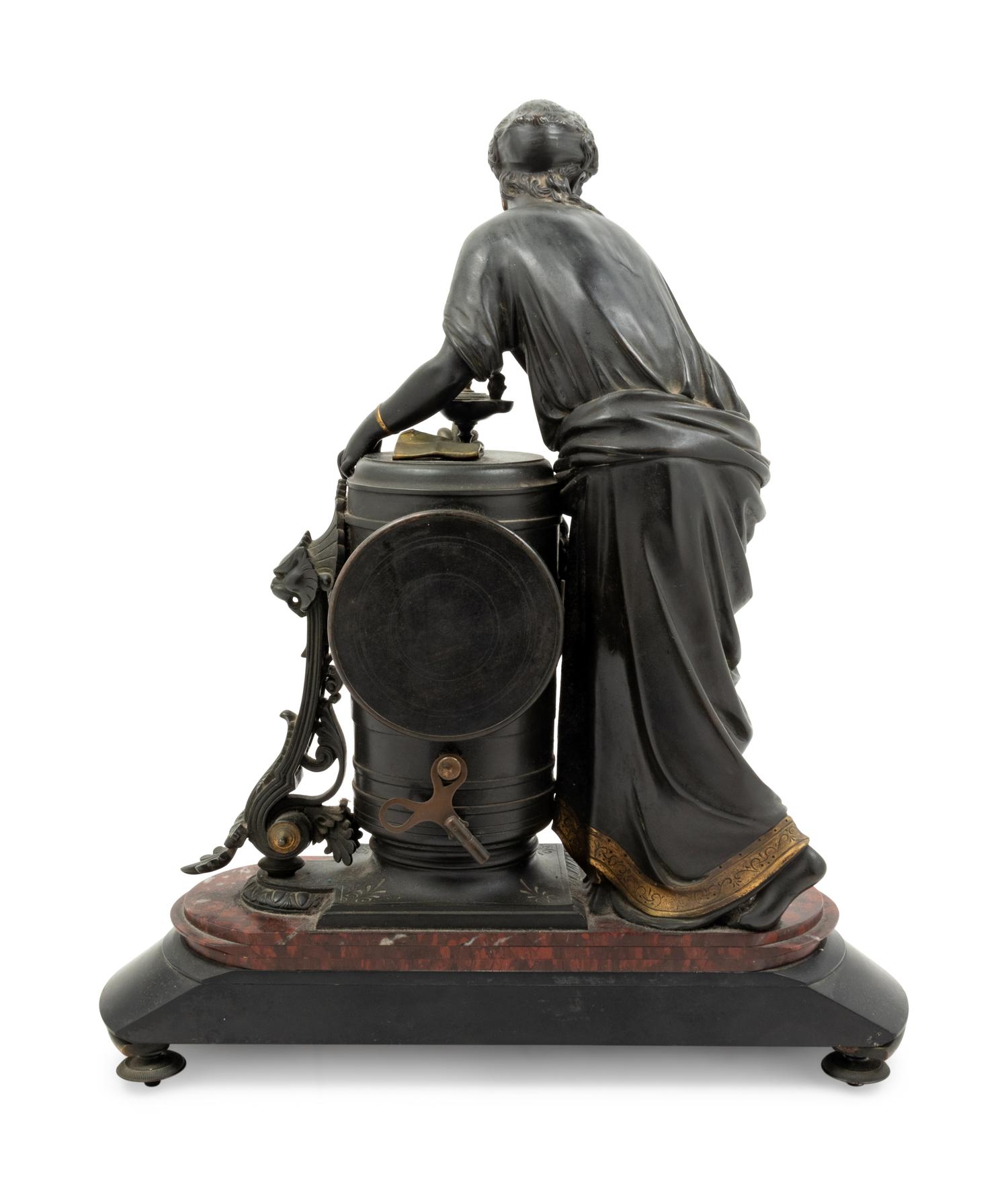 A French Gilt Bronze and Marble Figural Mantel Clock