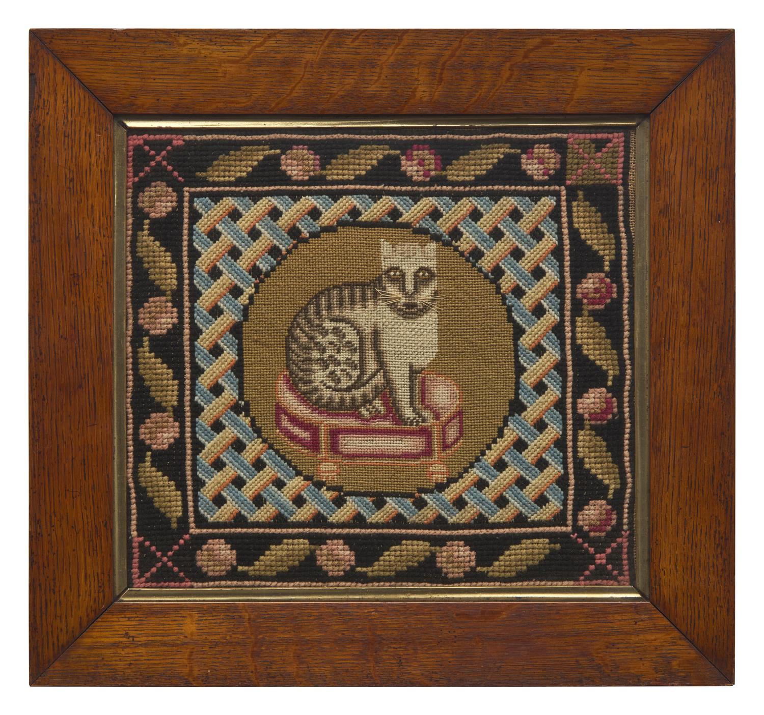 A Needlepoint Picture Depicting a Cat Seated on a Stool