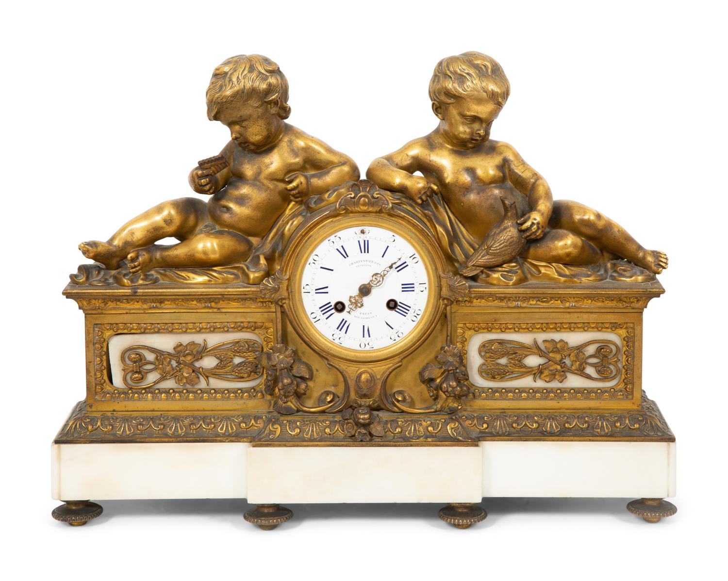 A Louis XV Style Gilt Bronze and Marble Mantel Clock