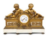 A Louis XV Style Gilt Bronze and Marble Mantel Clock