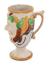 A Staffordshire Pottery Satyr Mug with an Interior Frog