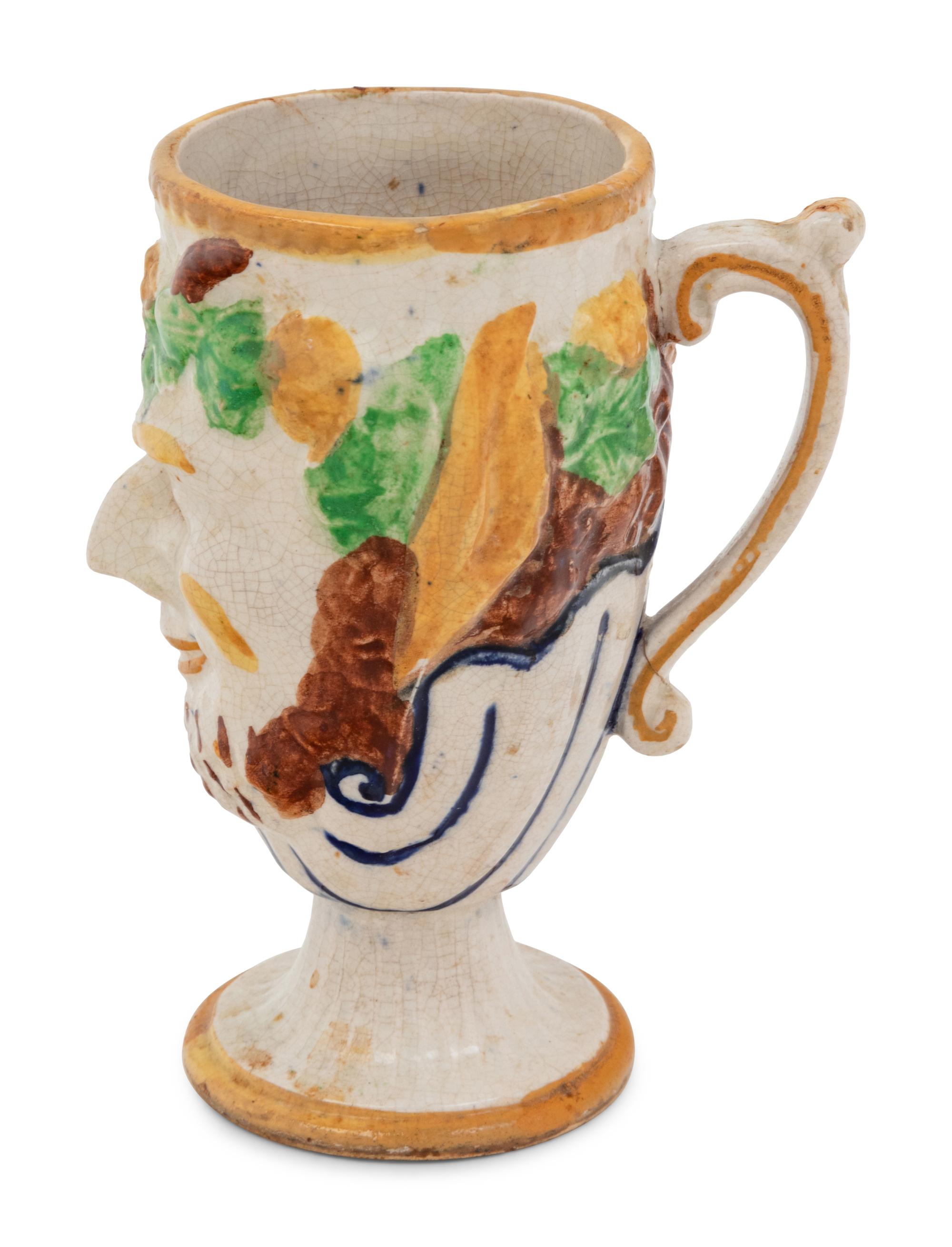 A Staffordshire Pottery Satyr Mug with an Interior Frog