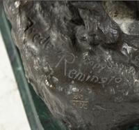 An American Bronze Figural Group, after Frederic Remington (1861-1909), Height 22 1/4 inches.