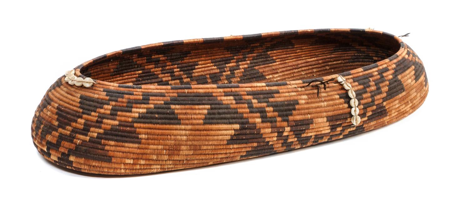 A Large Pomo Oval Gift Basket Height 2 3/4 x length 21 x width 9 inches.